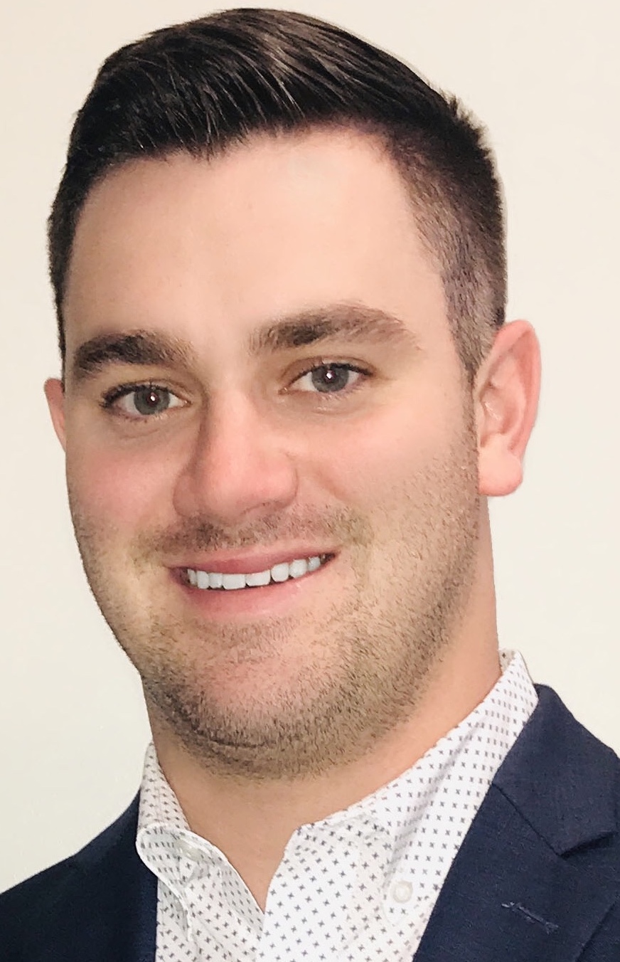 Headshot of Travis Smyczynski