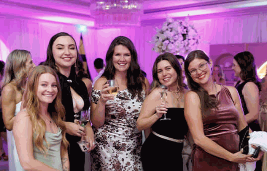 Guests toasting at Soft Girl Millions