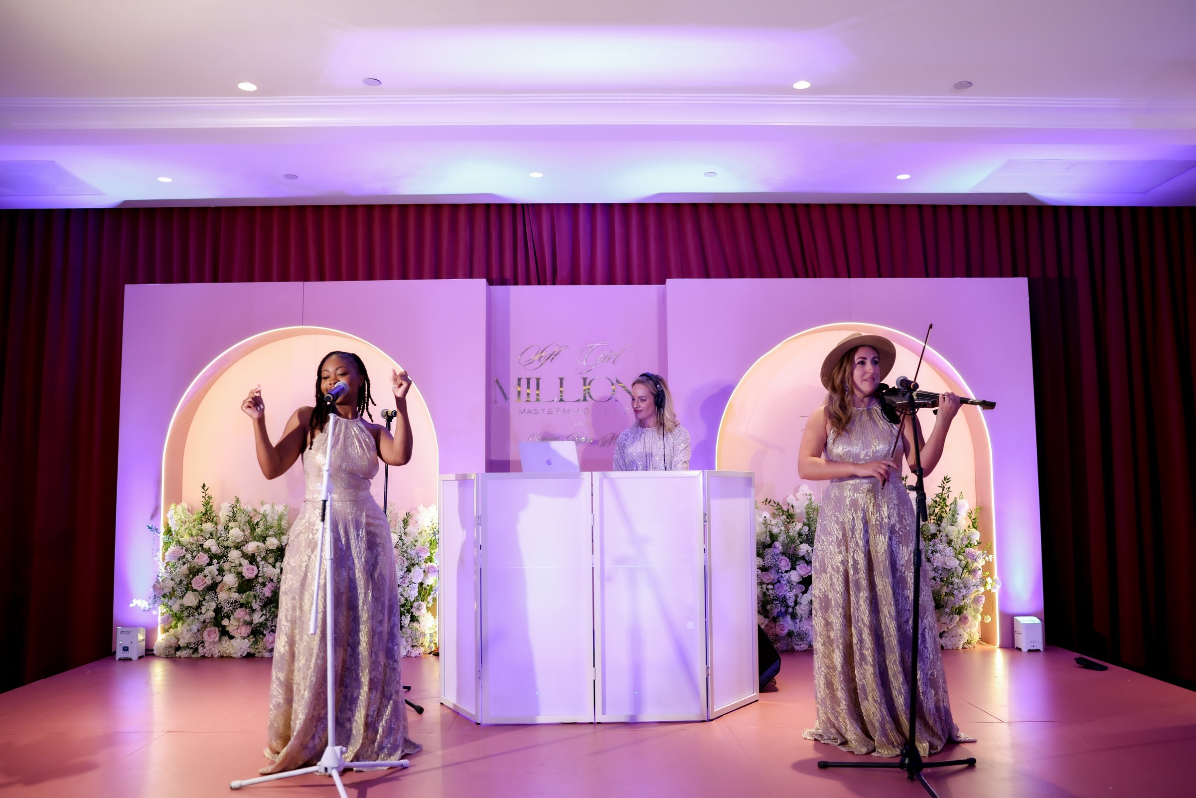 Live performers on stage at Soft Girl Millions Mastermind Live 2025