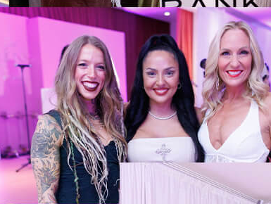 Three women together at Soft Girl Millions Mastermind Live 2025