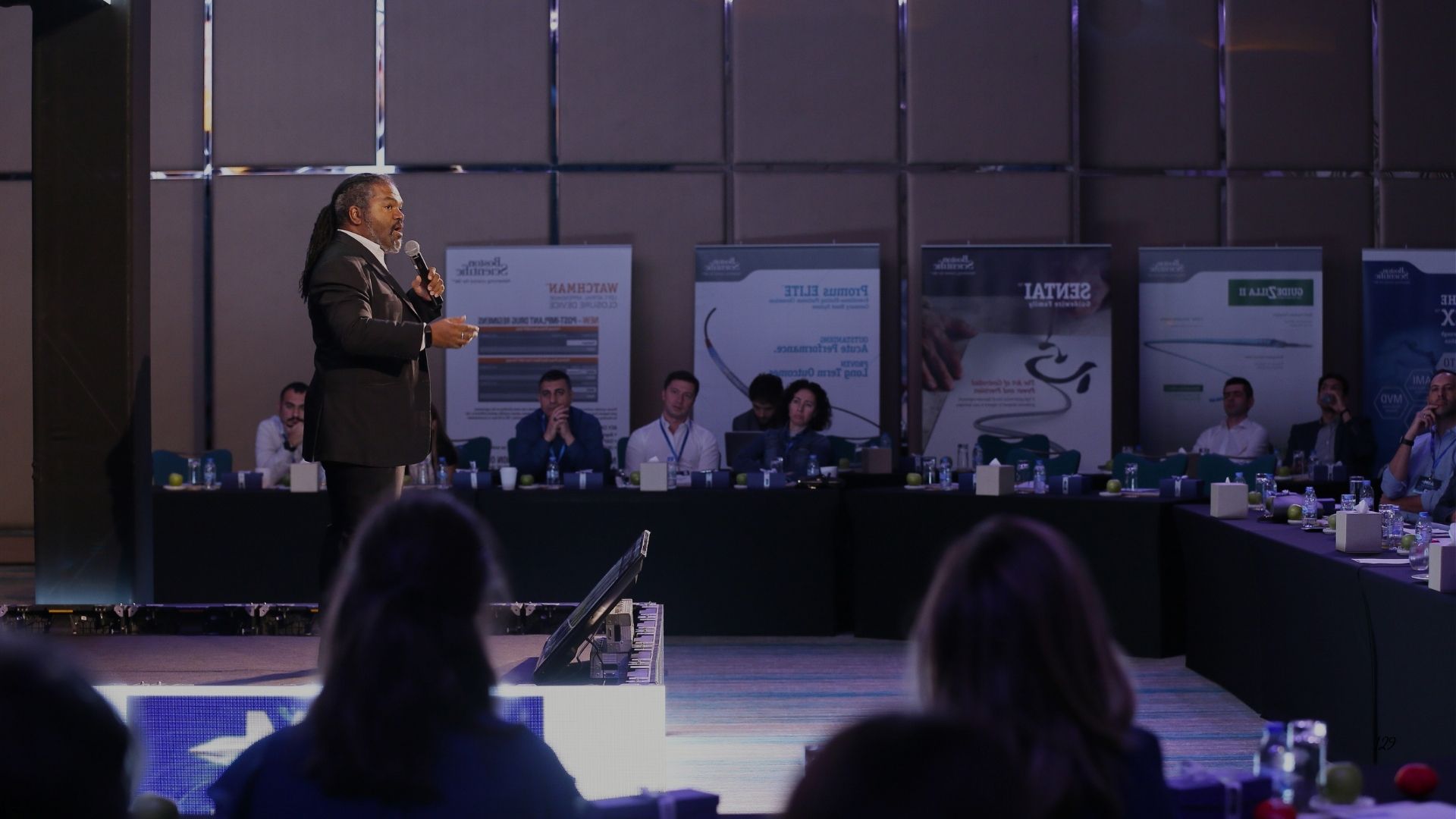 Dave Crane speaking to senior leaders at a major event