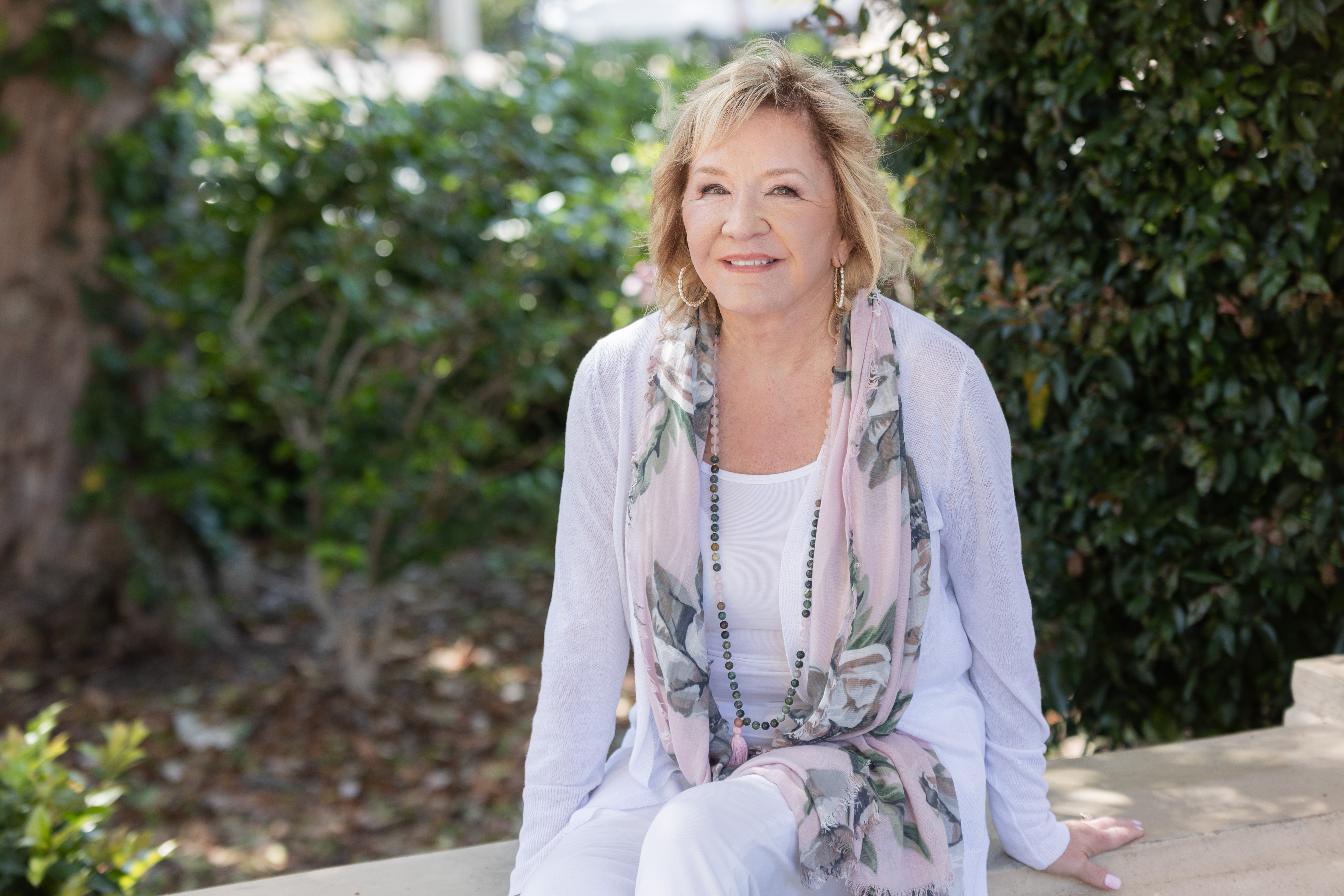 Deb seated, pink floral scarf