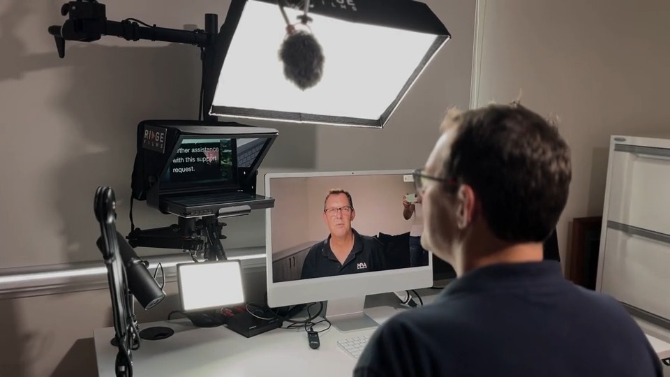 A client reading from the teleprompter during a script support call