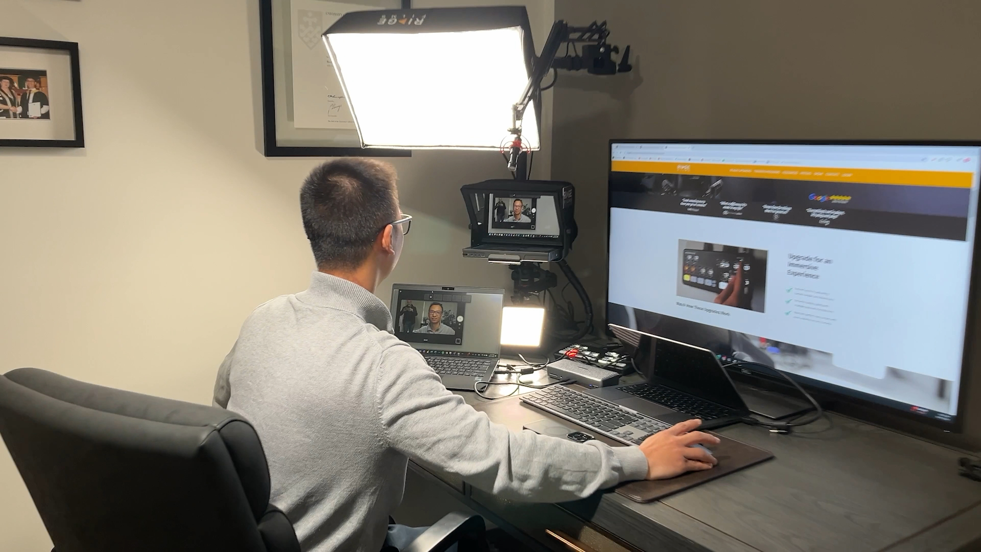 Over the shoulder of a client presenting his website on camera