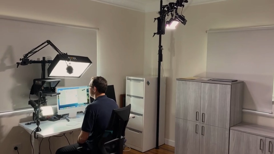A Desktop Studio installed around an iMac in a spare room