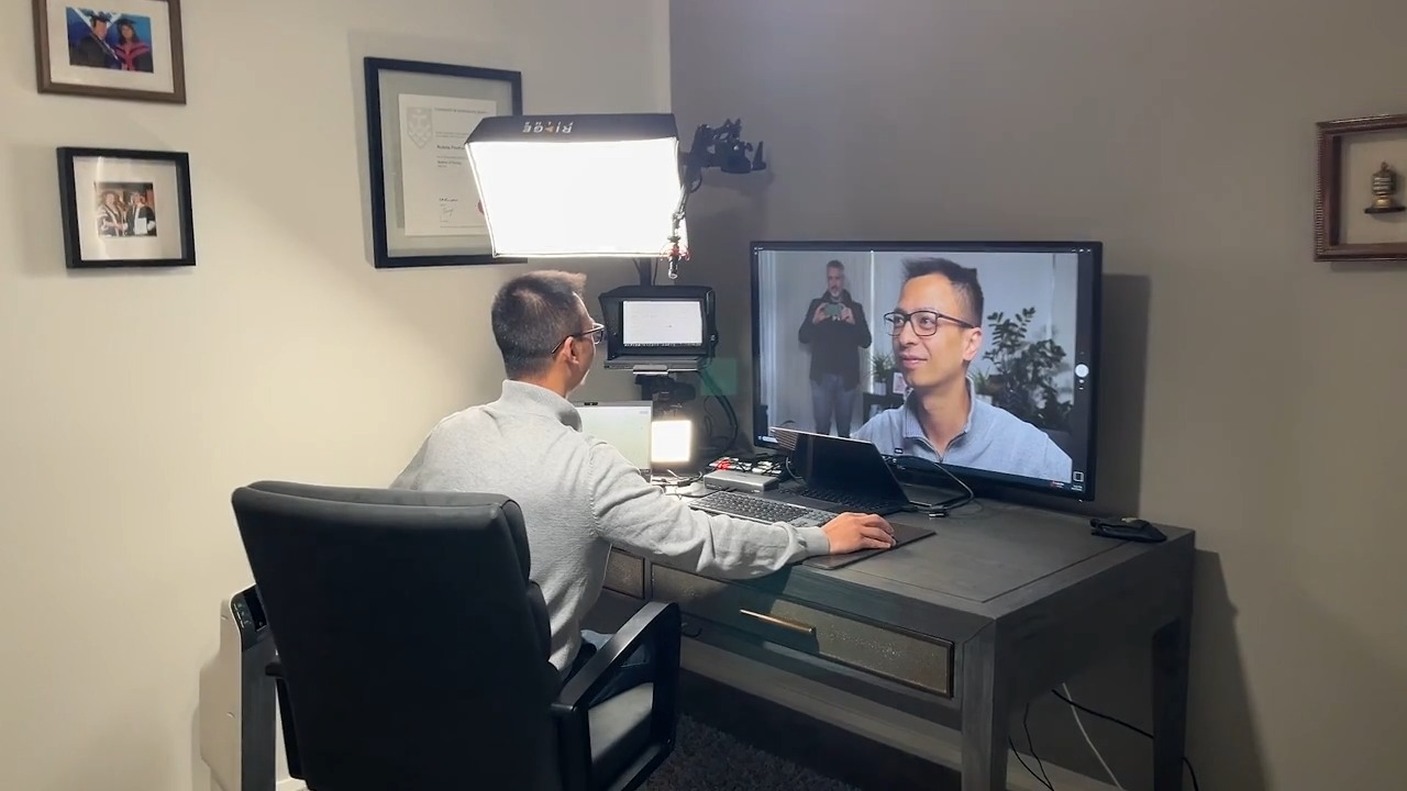A client on a video call with the studio lighting set up