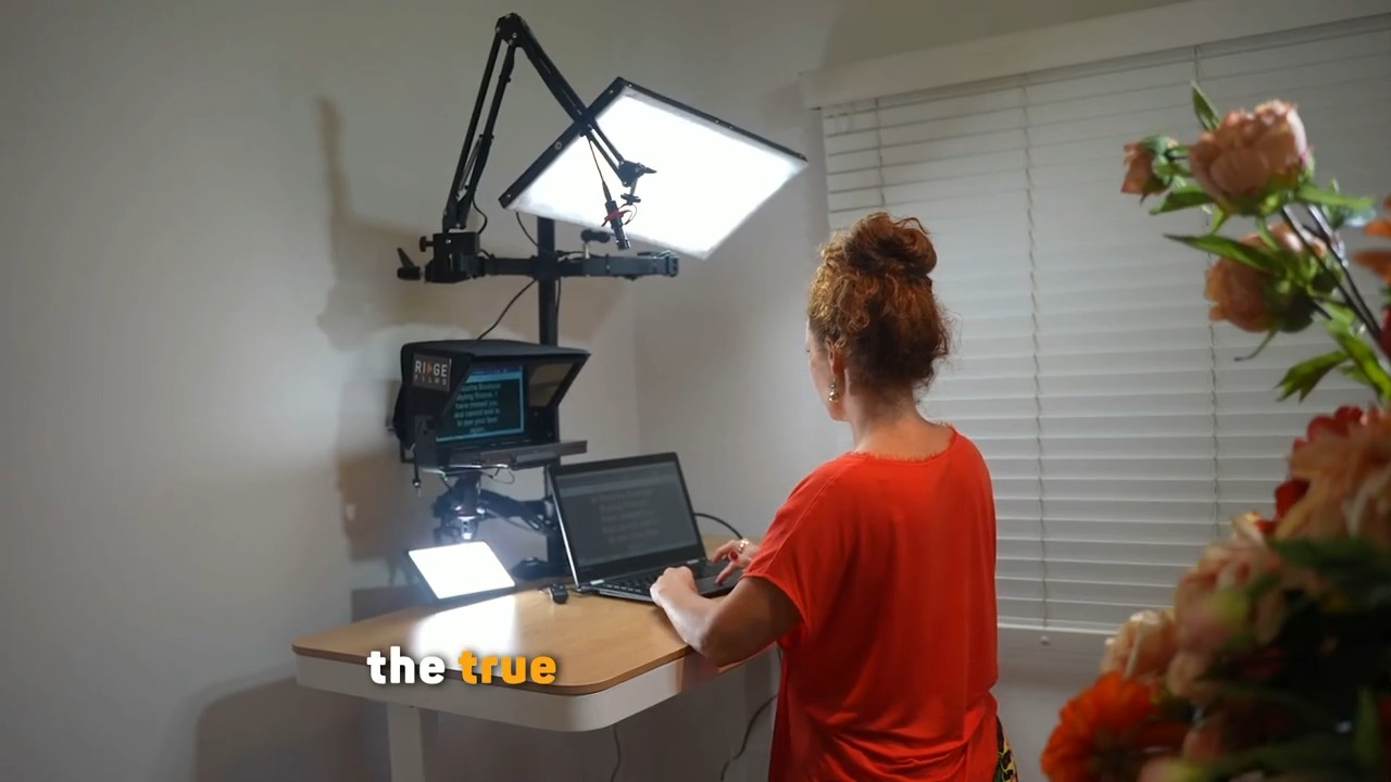 A client recording at a standing desk beside a vase of flowers