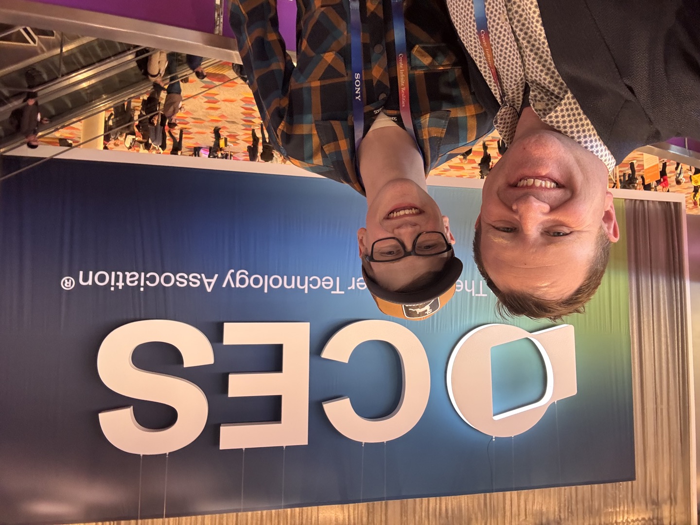 Troy and Luke in front of the CES sign in Las Vegas
