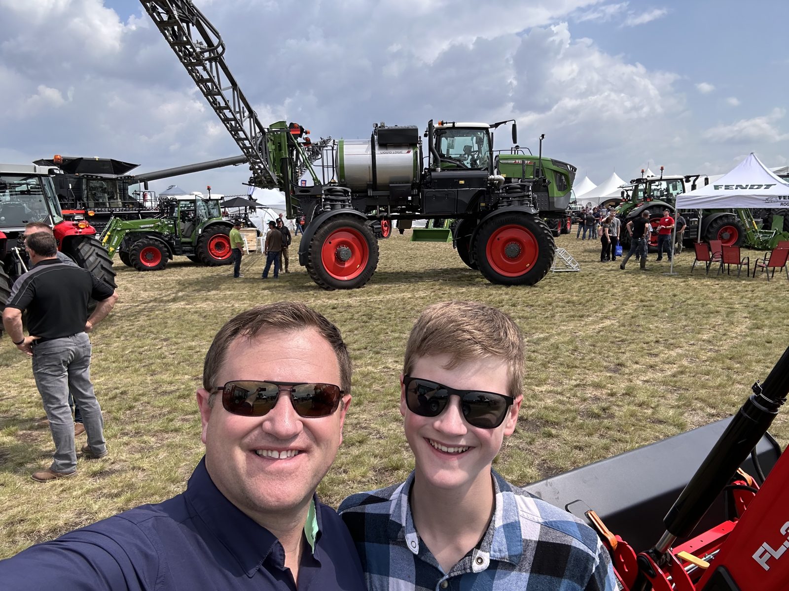 A self-propelled Fendt Rogator crop sprayer.