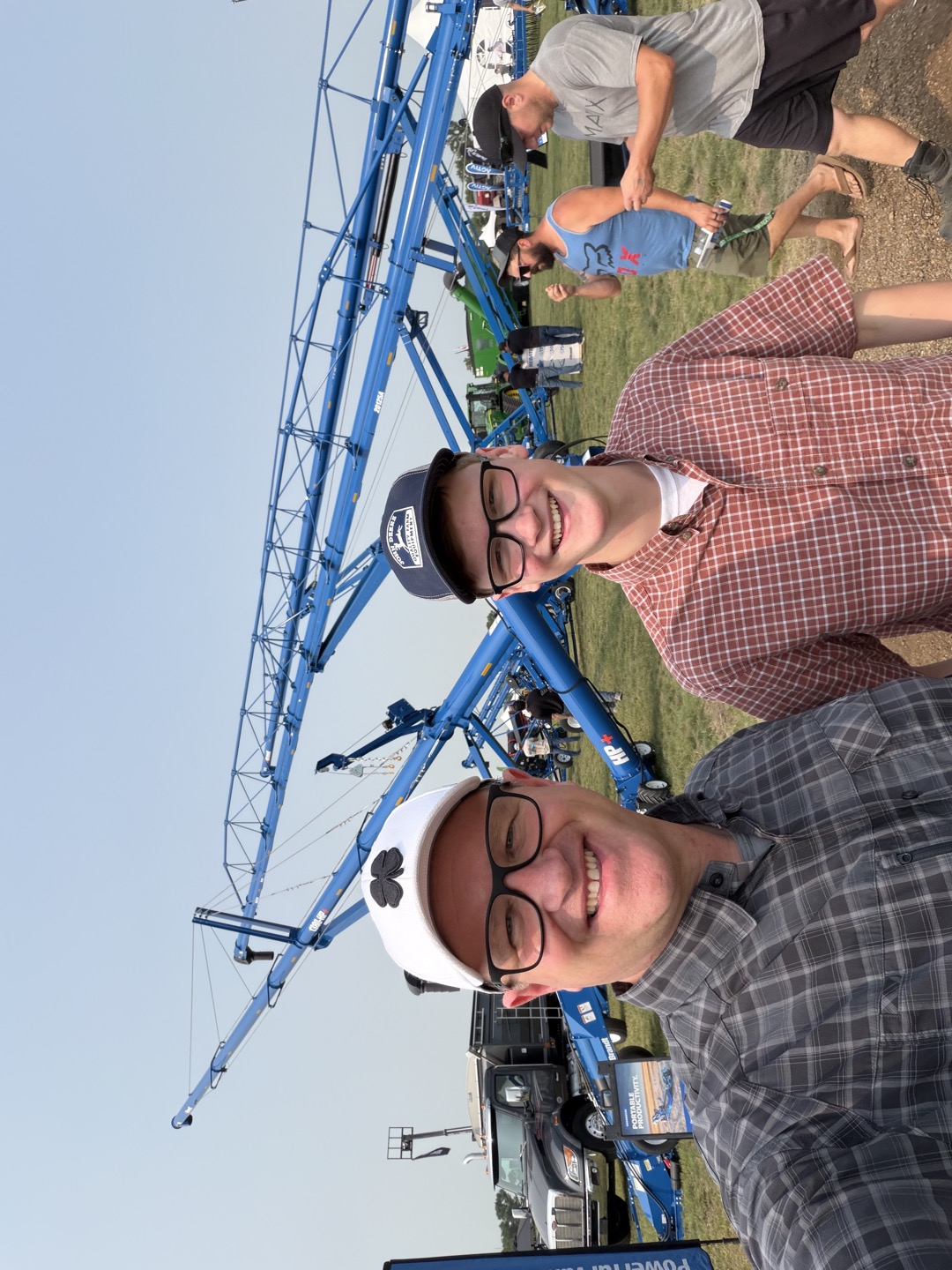 A moment together at the Brandt grain-handling exhibit.