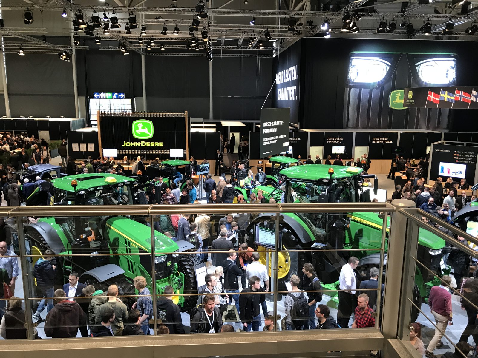 Tractors, visitors, and conversations across the exhibition space.