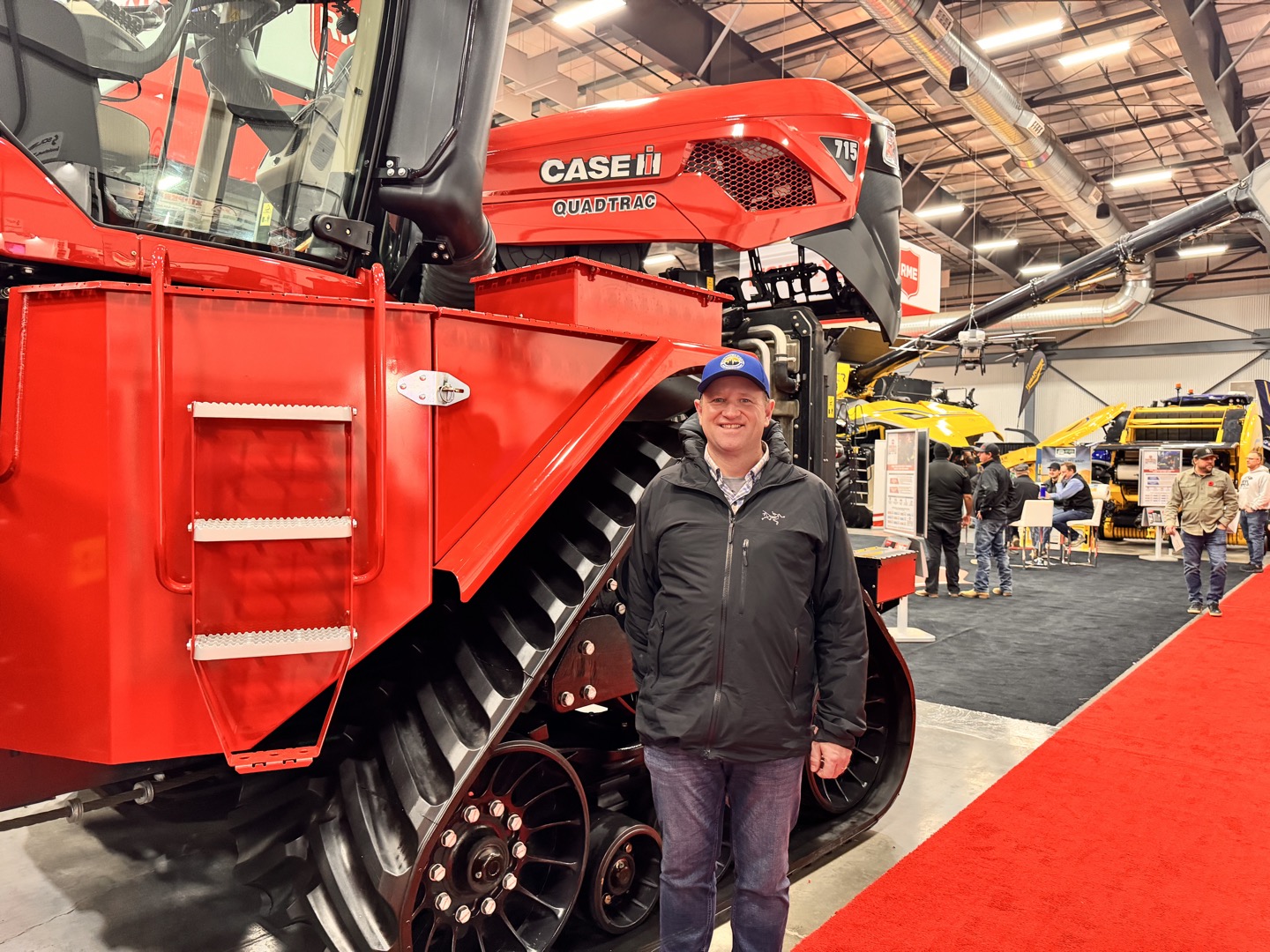 Beside the Case IH Quadtrac 715.