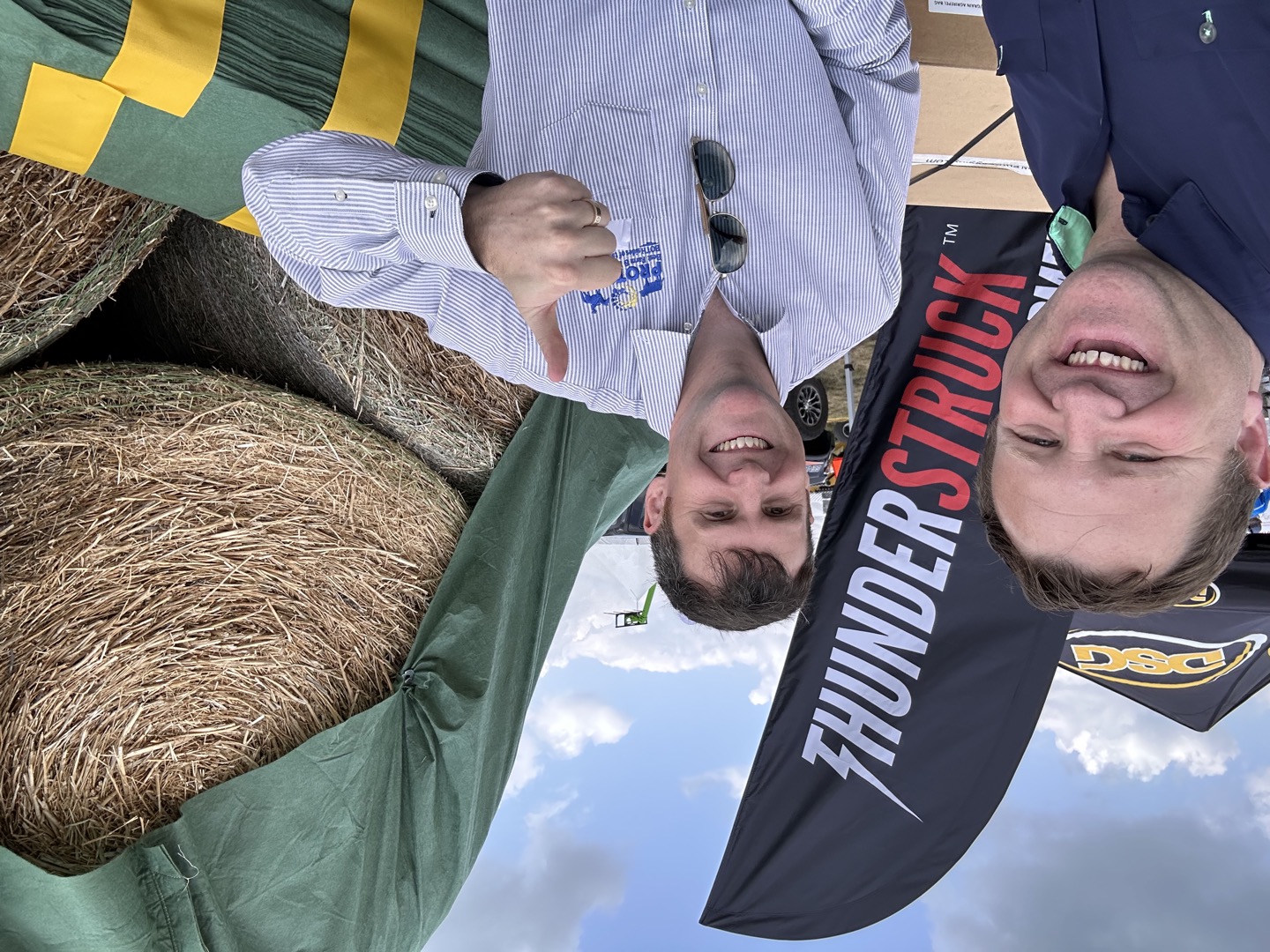 Connecting at a display with Thunderstruck branding.