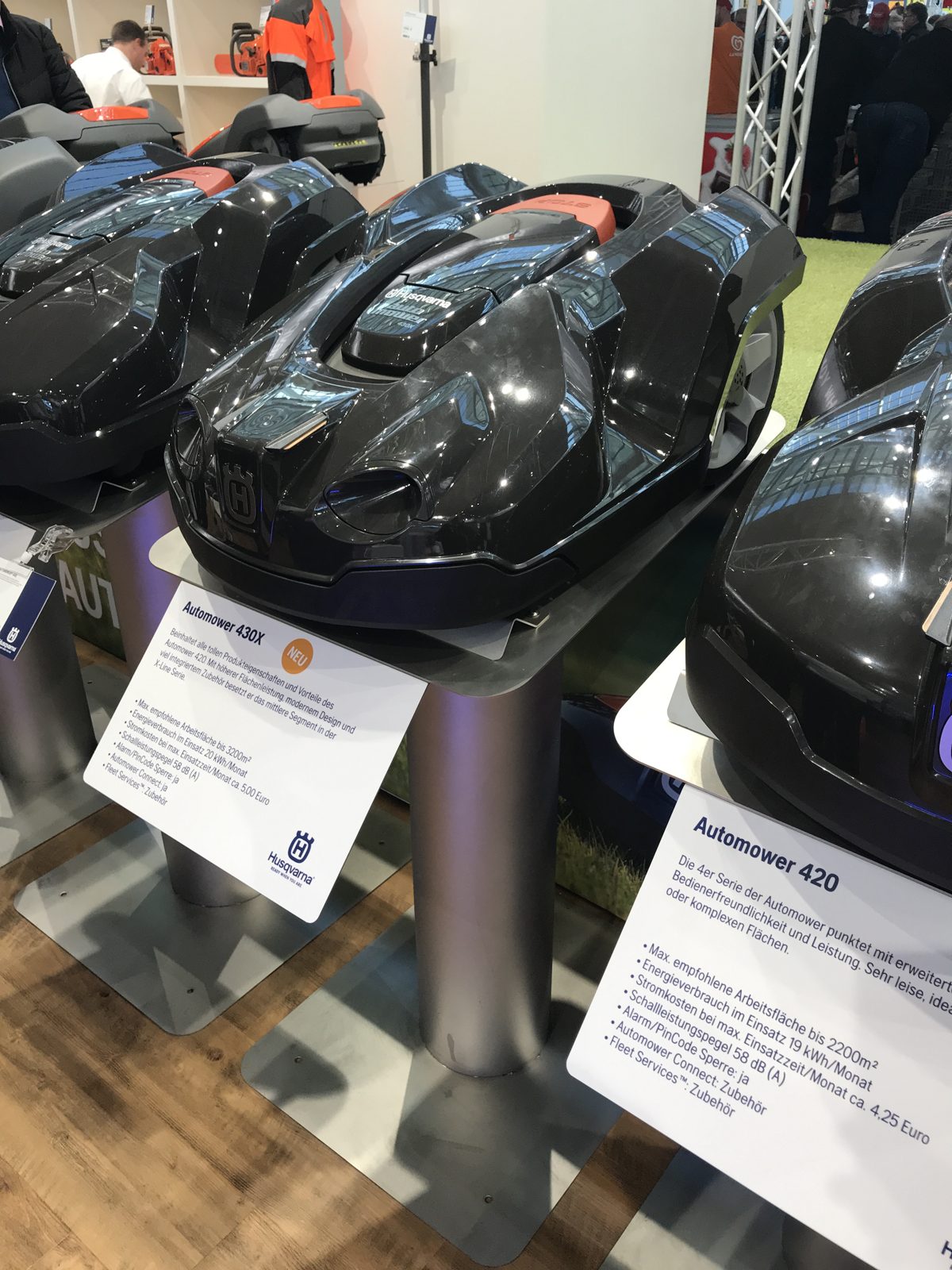 Automower 430X and 420 robotic mowers on display.