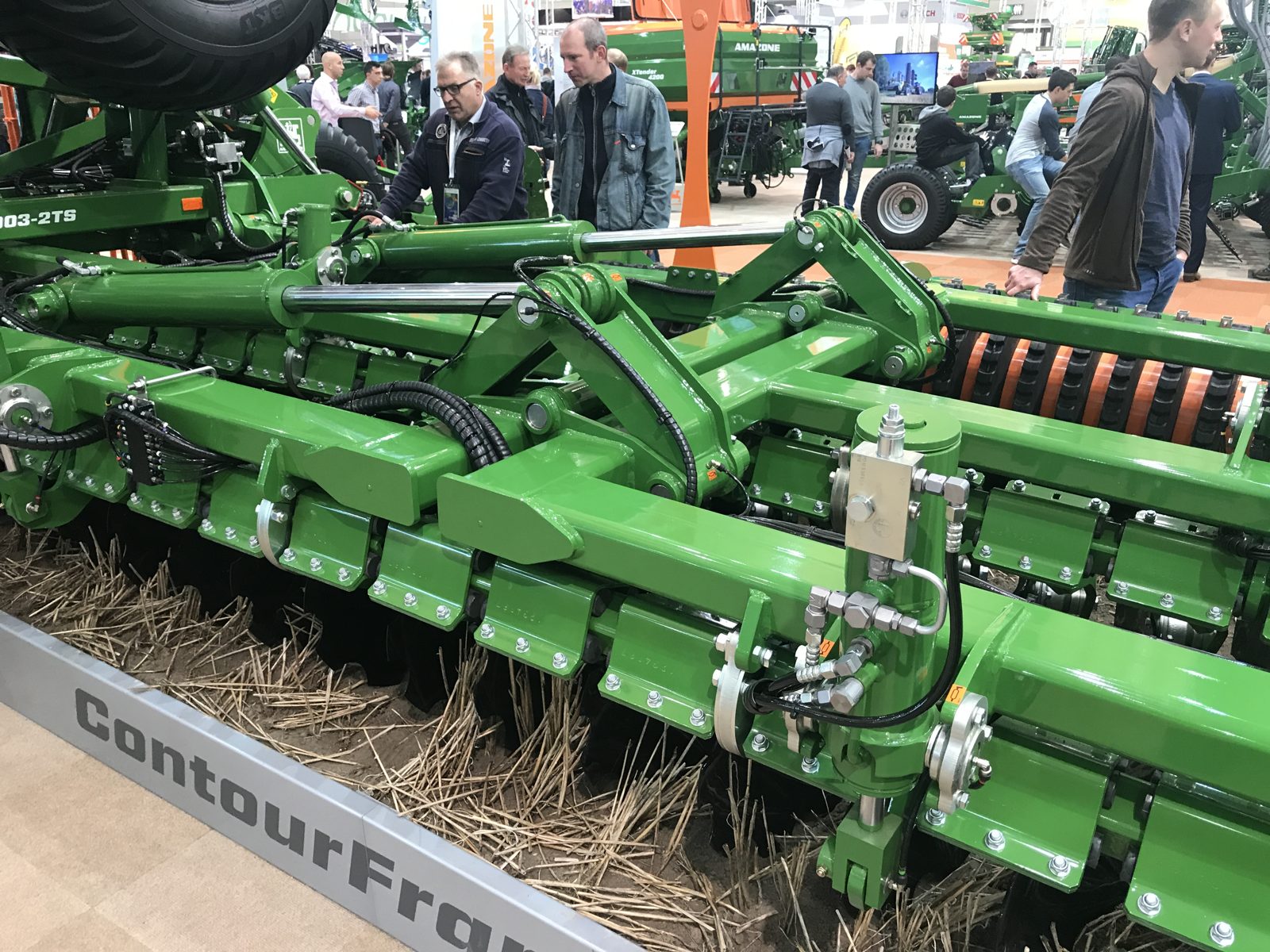 Hydraulics, discs, and frame components on an AMAZONE equipment display.