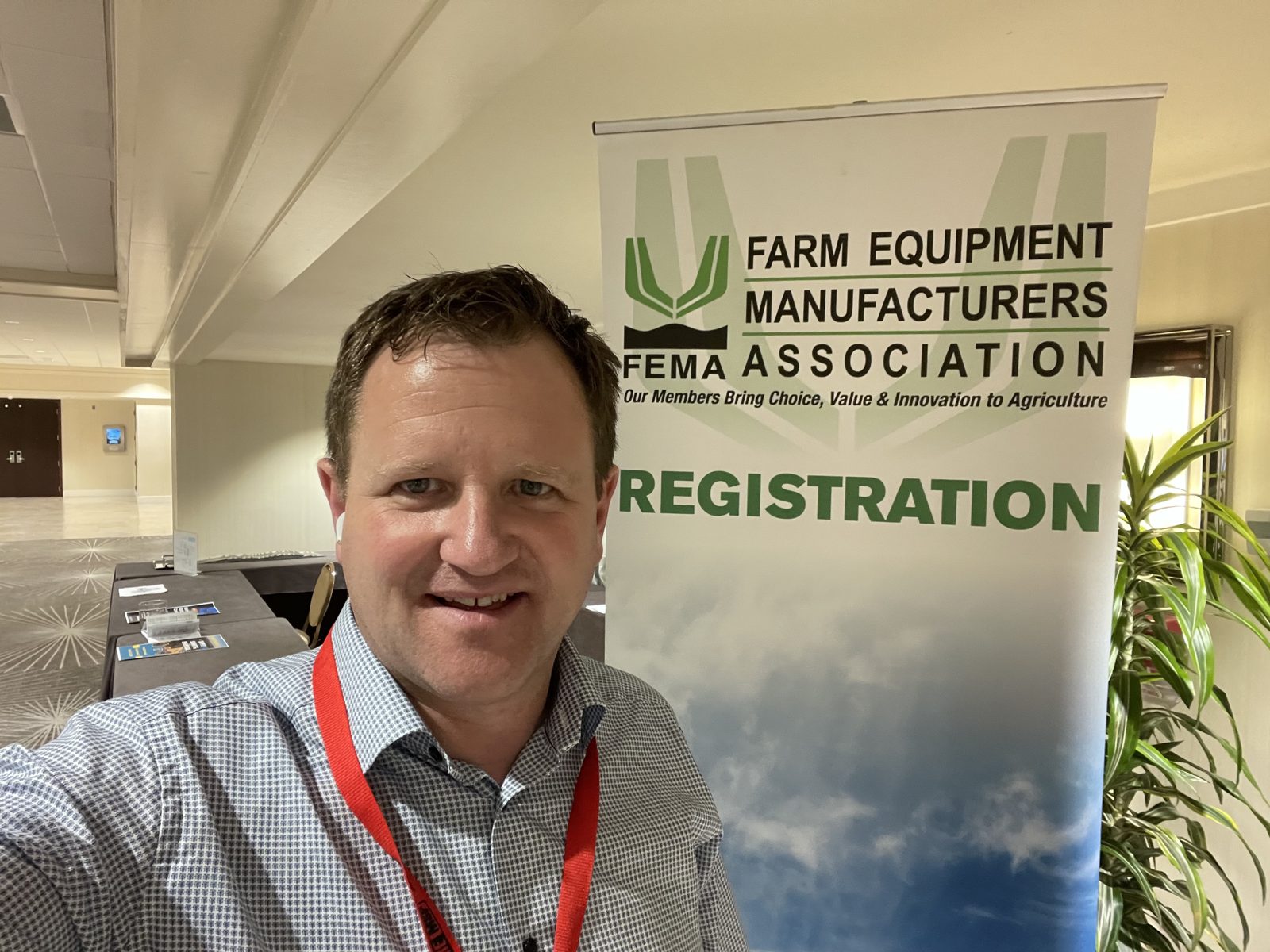 Farm Equipment Manufacturers Association registration and event signage.