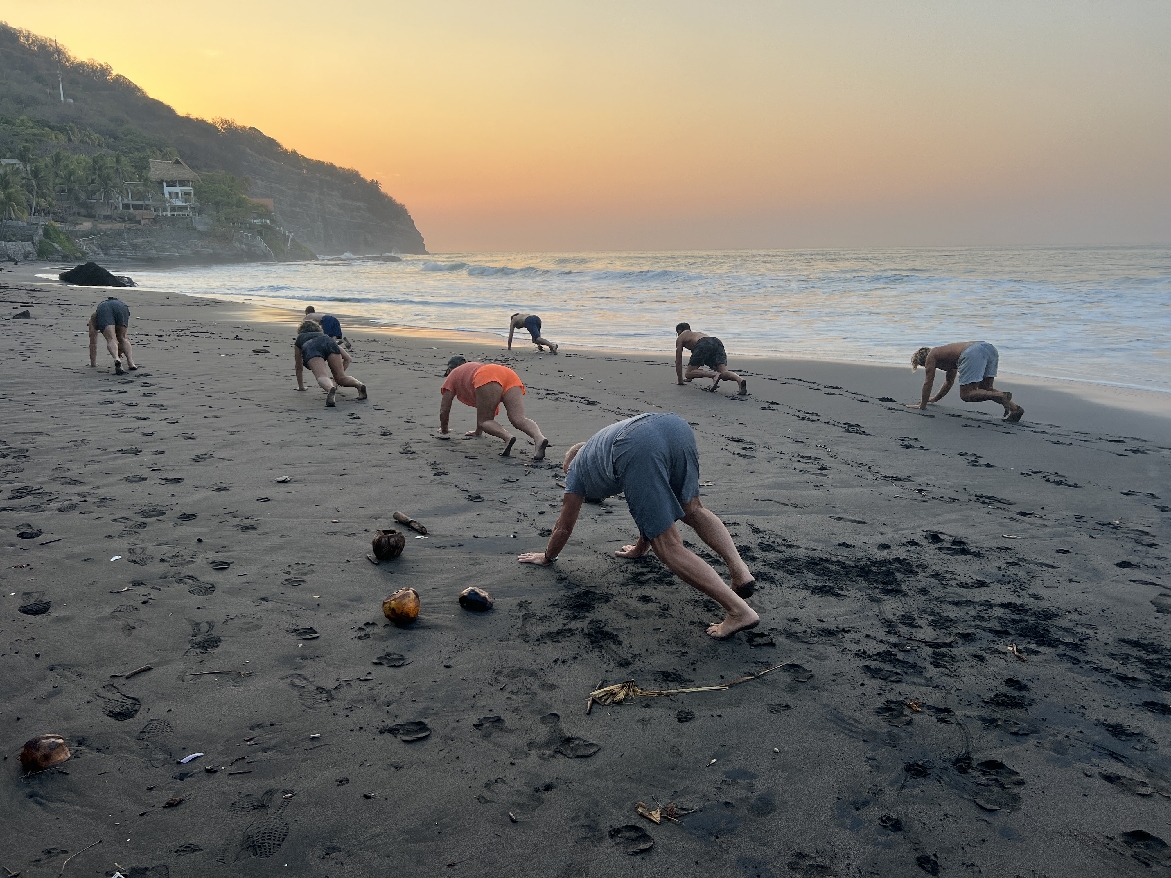 Natural Movement practice on the beach at dusk