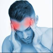 Man holding his head with a headache