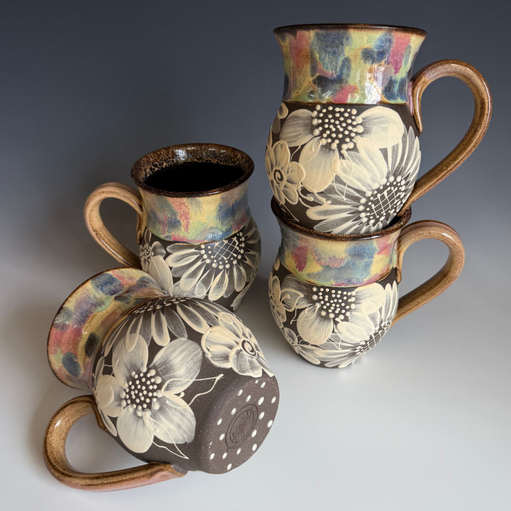 Ceramic mug with a sculpted caterpillar handle