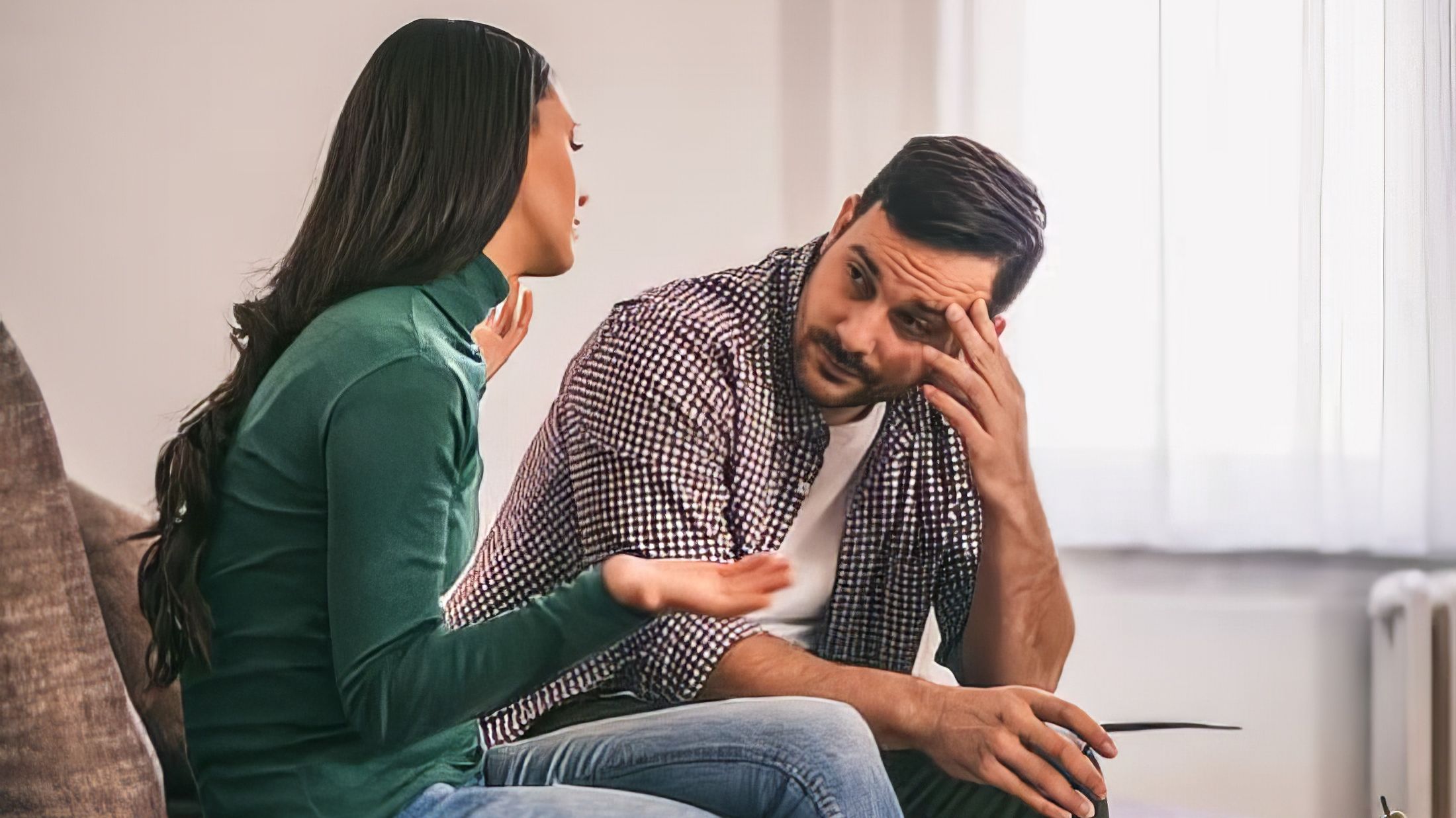 A woman telling her partner how she feels while he shuts down