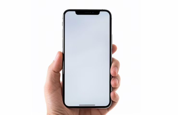 A hand holding a phone with a blank screen