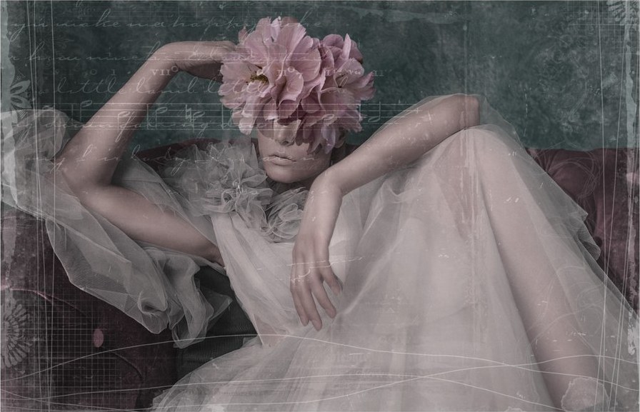 Seated figure in tulle under text and texture overlays