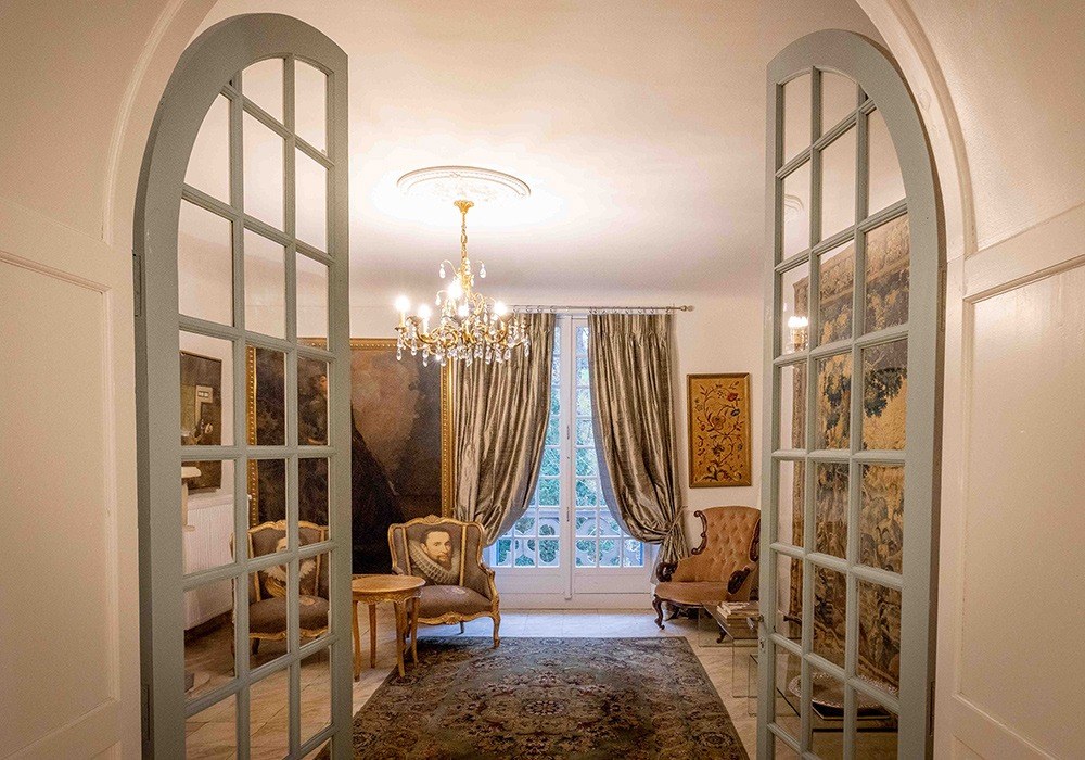 Château salon seen through open French doors