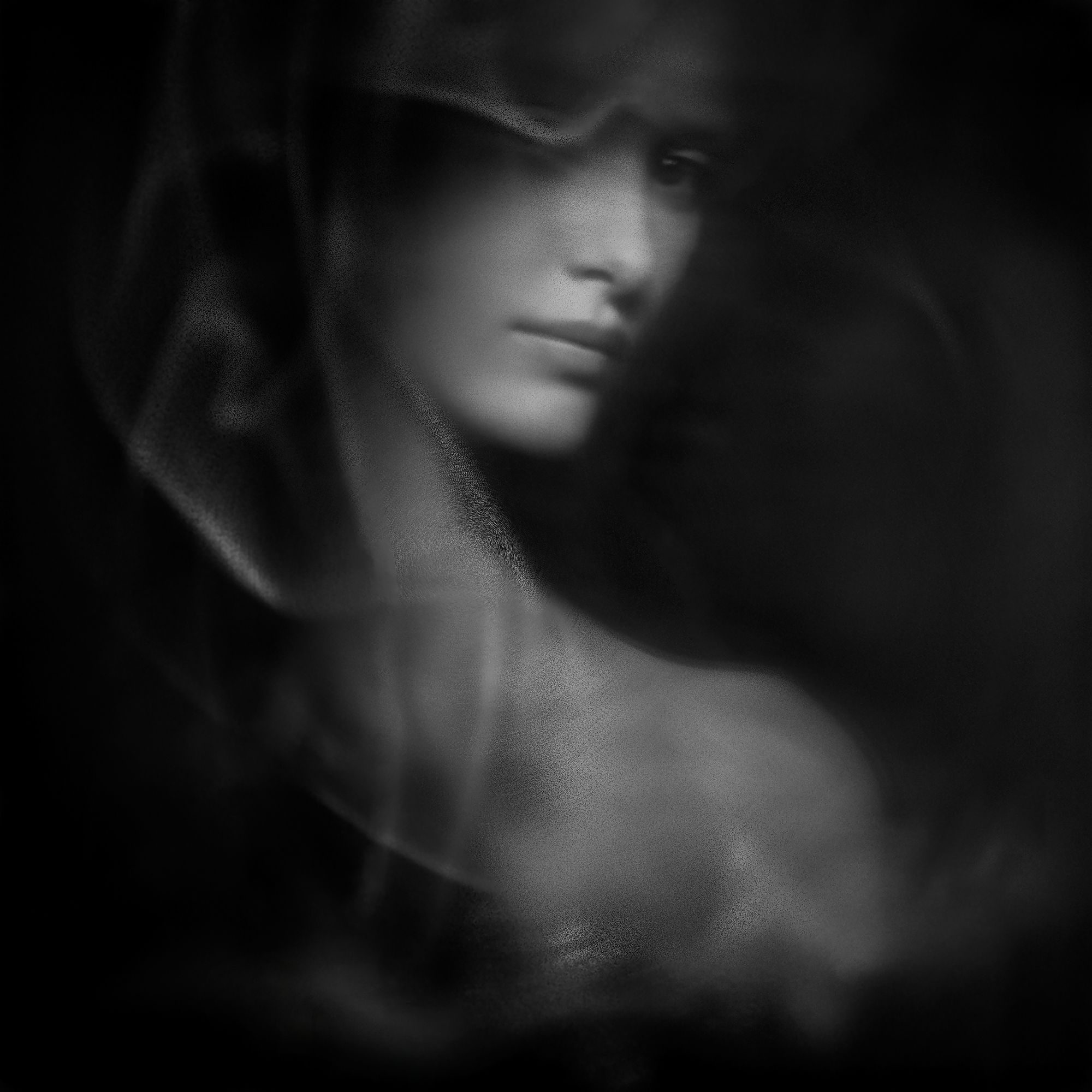 Silent Grace, a figure wrapped in soft flowing blur like fabric or mist