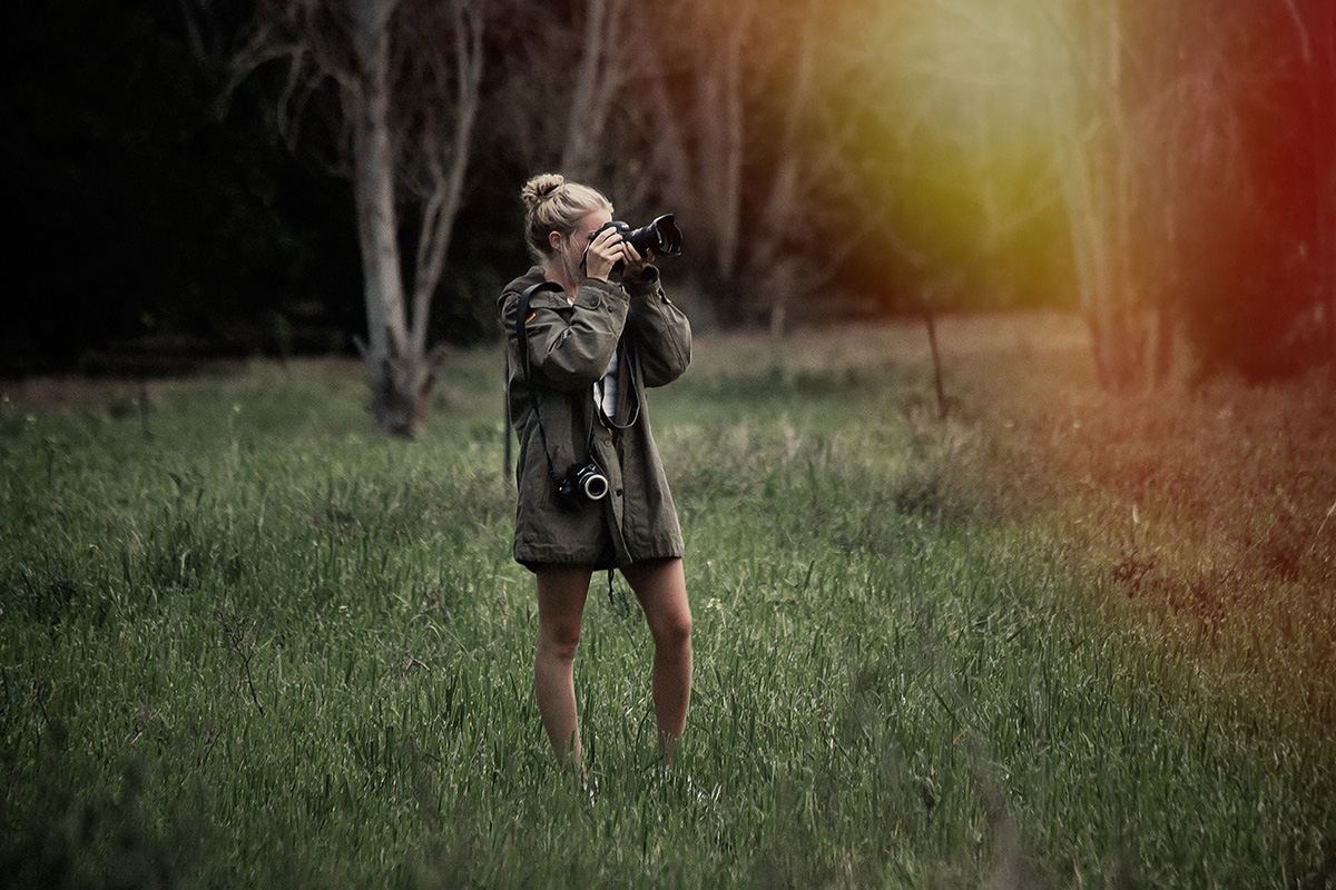 Samantha Lee Osner photographing in a field