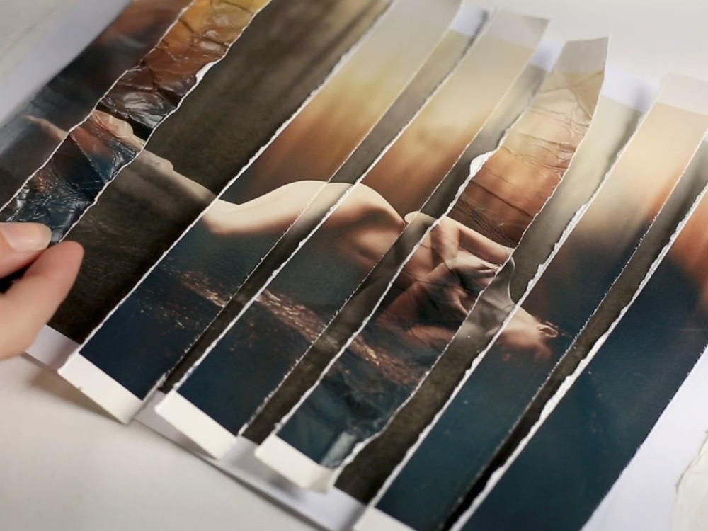 A photographic print torn into strips and rebuilt, the photo montage technique