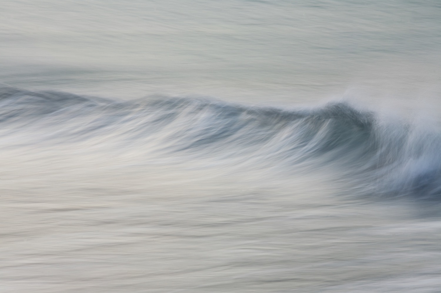 Soft monochrome study of a wave folding over itself