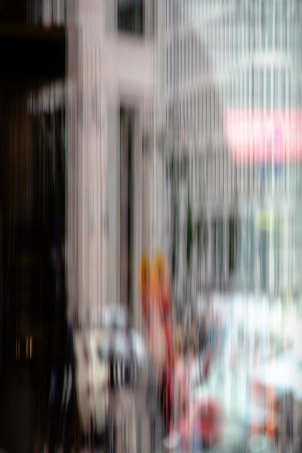 City Life 1, a street of pale facades pulled into vertical streaks, with flashes of red and orange below