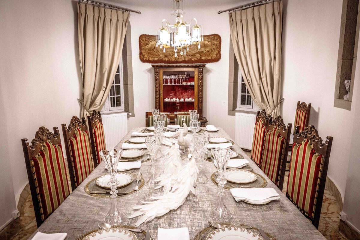 Long château dining table laid for dinner