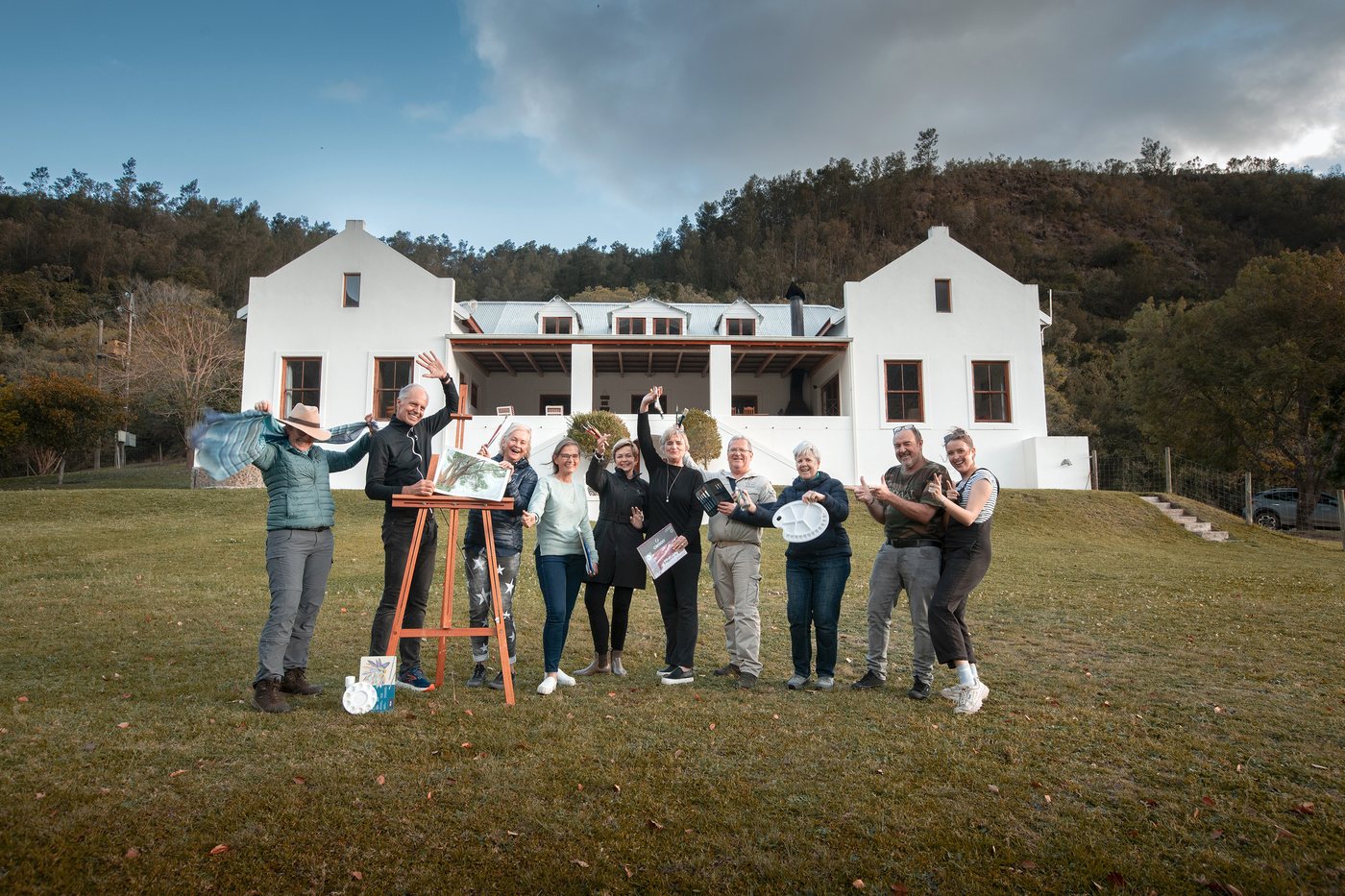 The retreat group photographed together in front of the manor house