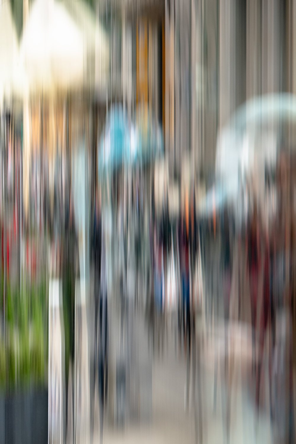 City Life 7, a long pavement of shoppers and shop fronts streaming upward in soft colour