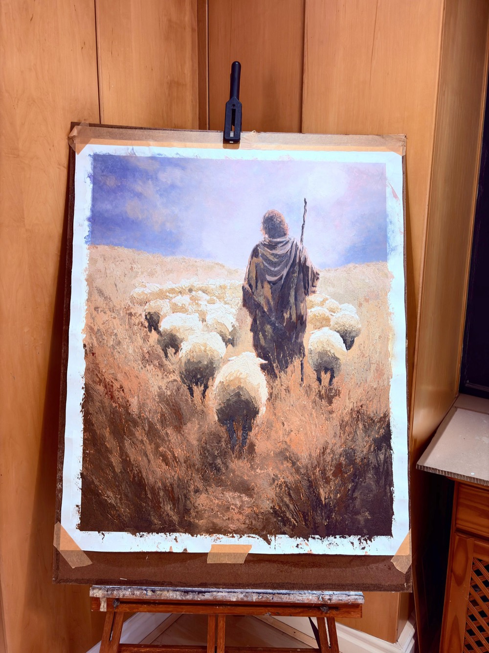 Eternal Shepherd unframed on the easel in Martin Osner's studio, the edges still taped