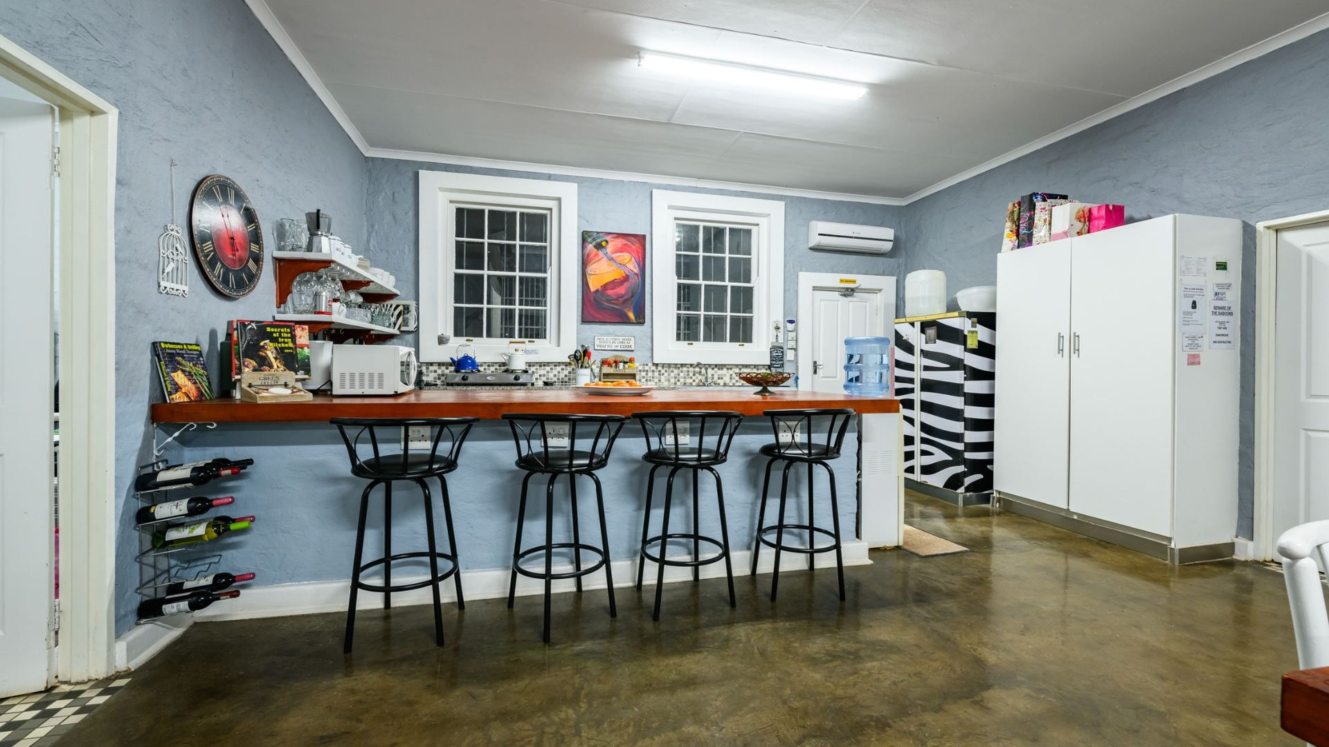 The shared kitchen with a breakfast counter and stools
