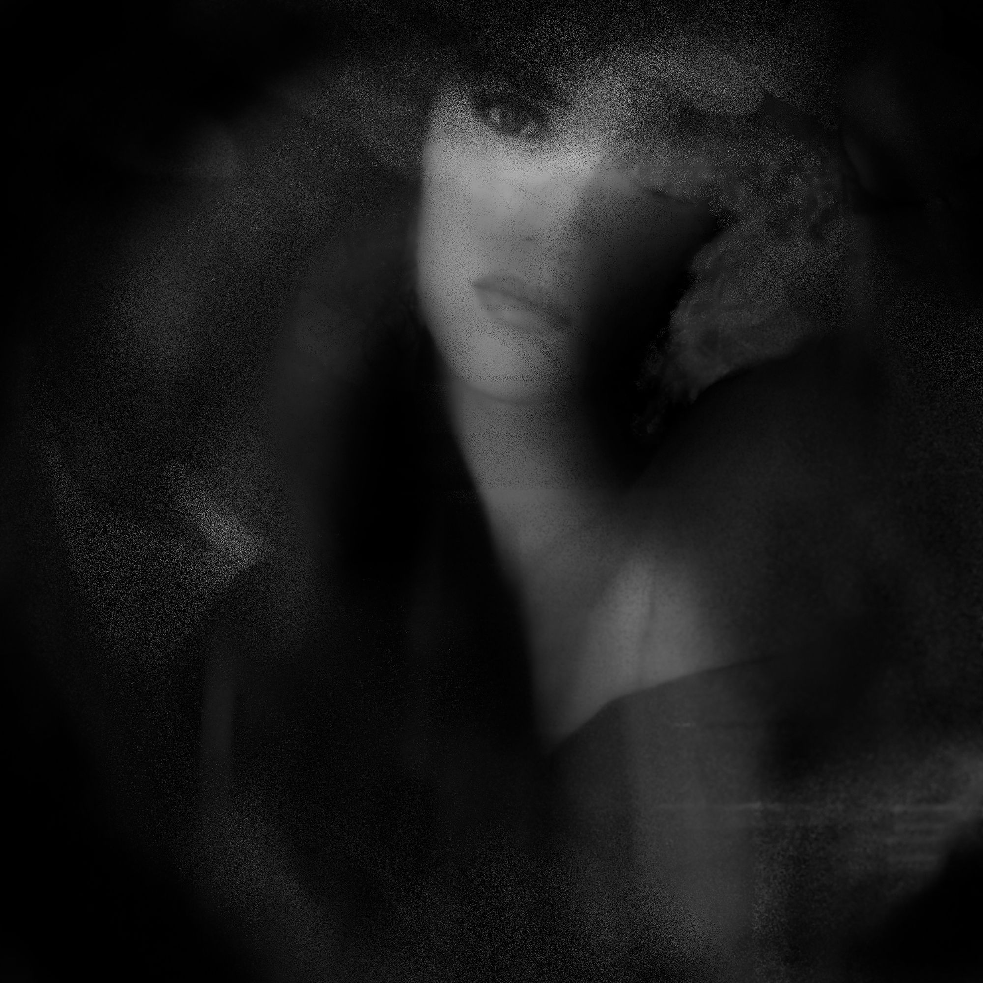 Beneath the Silence, a monochrome portrait in deep shadow with a single lit eye