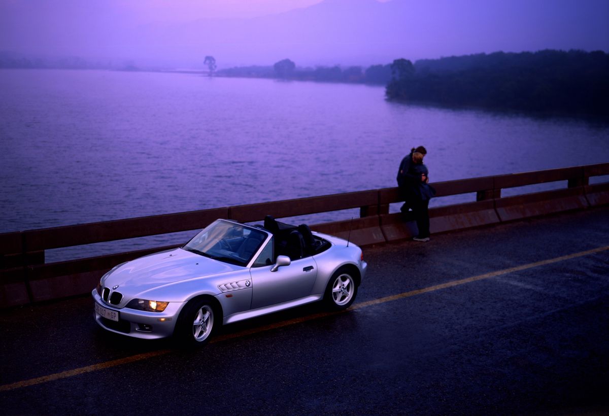 Last light, a wet road, and a car that still has to read as silver. Colour temperature judged at the moment of capture rather than corrected afterwards.