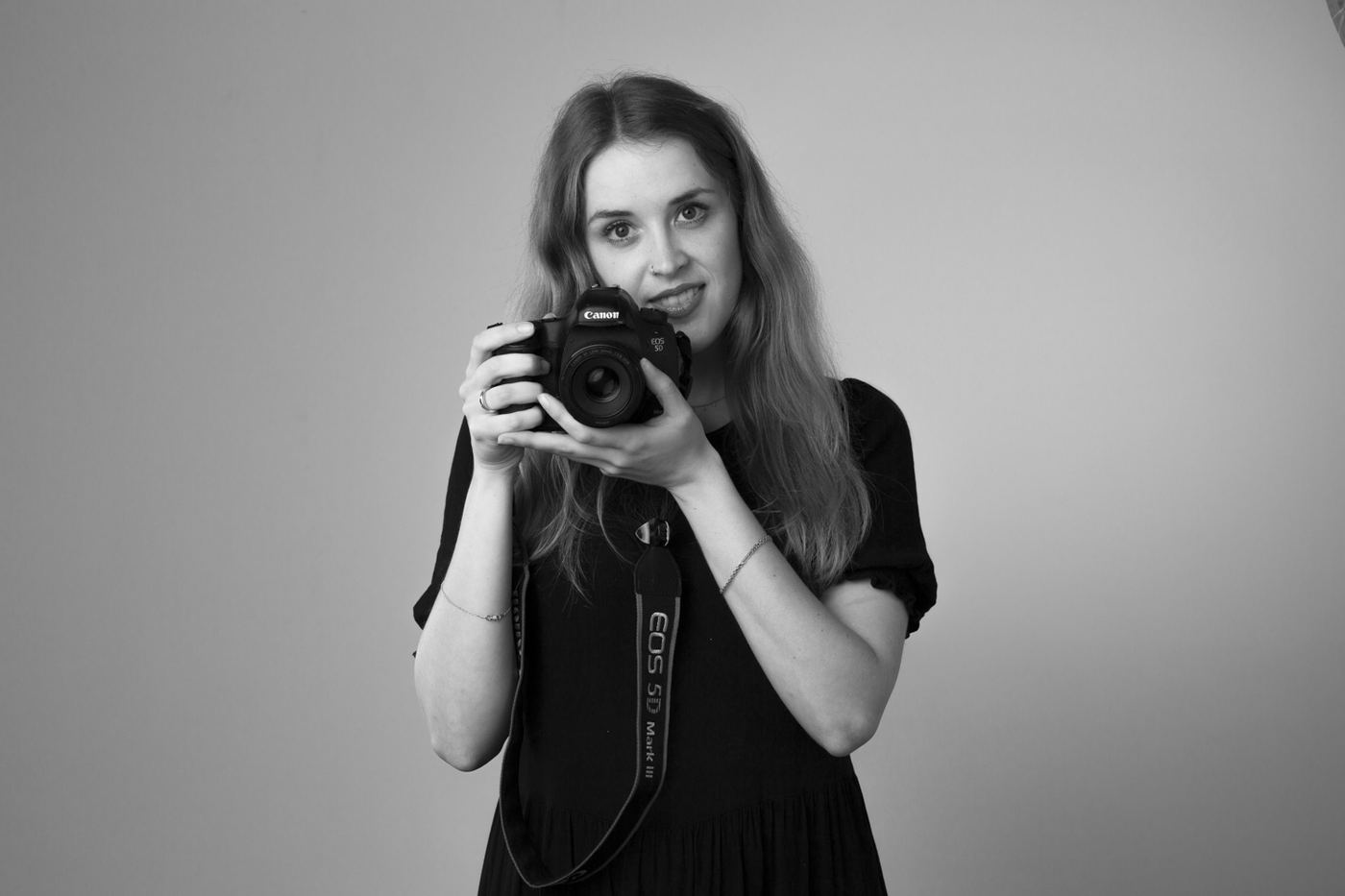 Samantha Lee Osner with her camera, black and white portrait