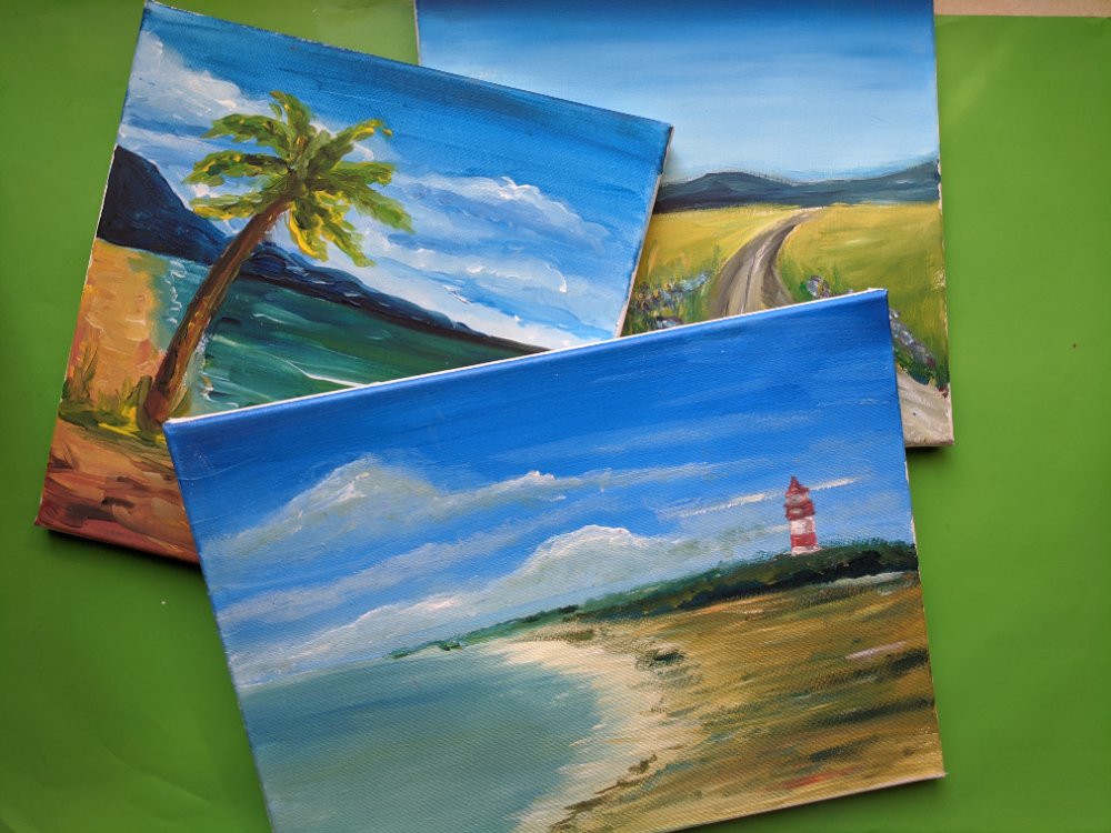 Three finished landscape canvases