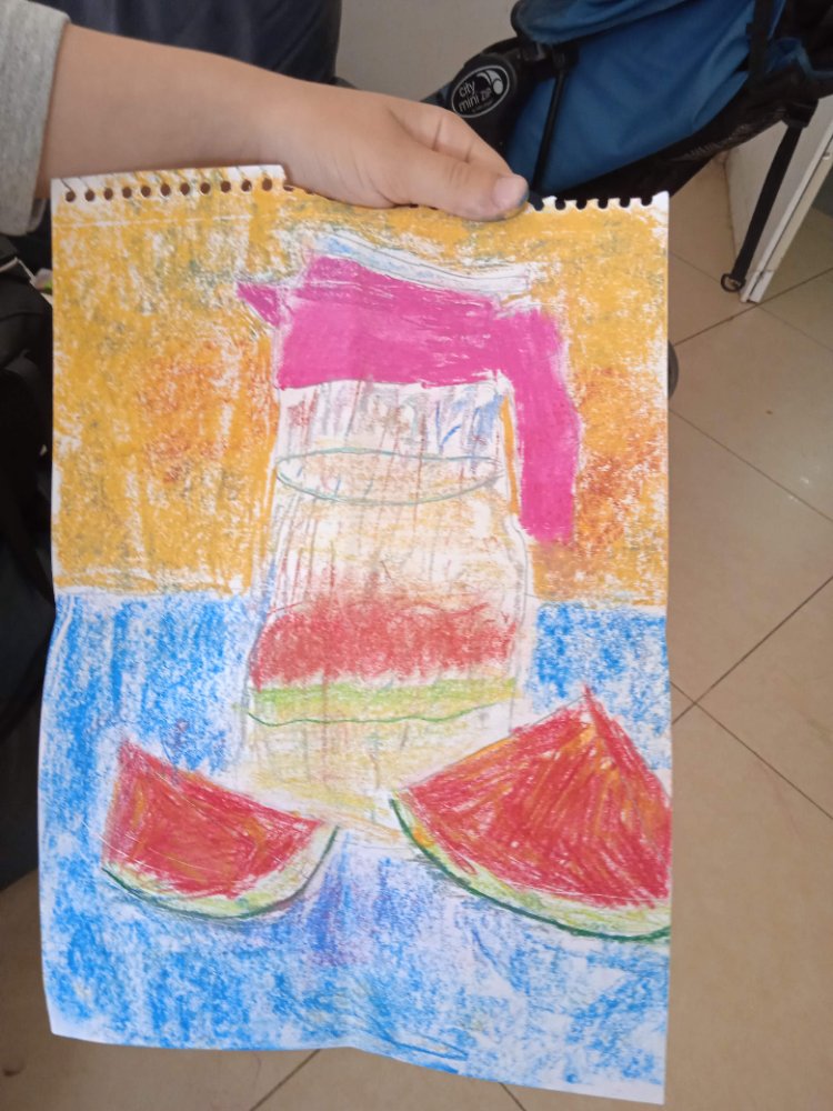 An oil-pastel still life of a pitcher with watermelon slices