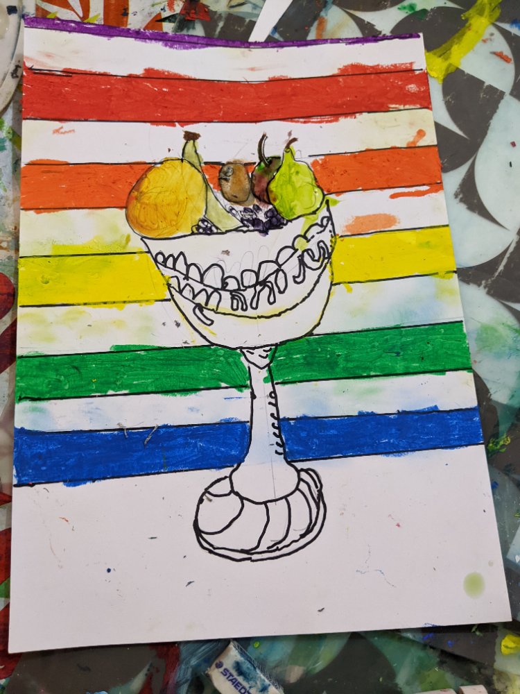 A pen-and-watercolour fruit bowl on a tall goblet over a rainbow-striped background
