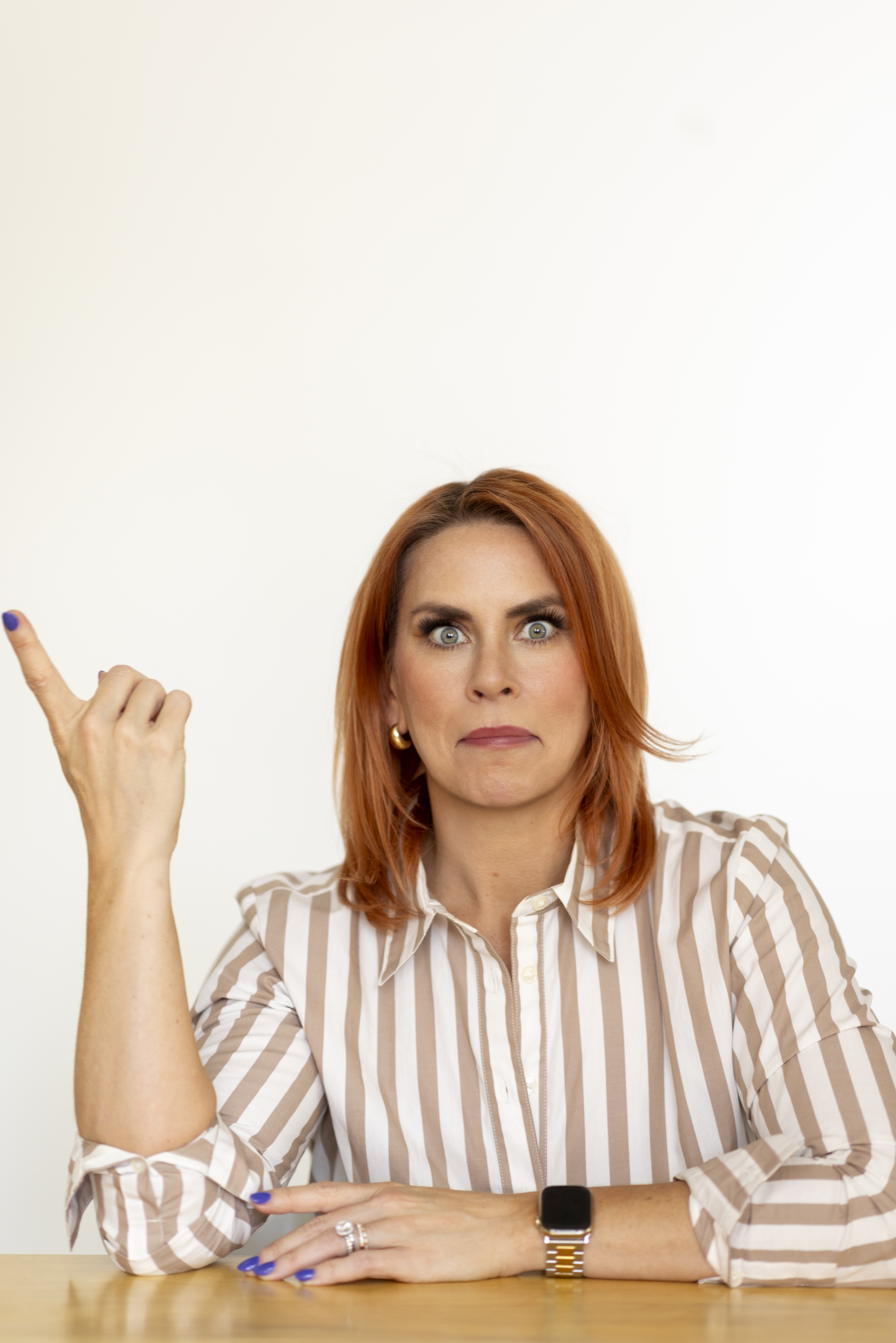 Portrait of a hiring expert pointing inward
