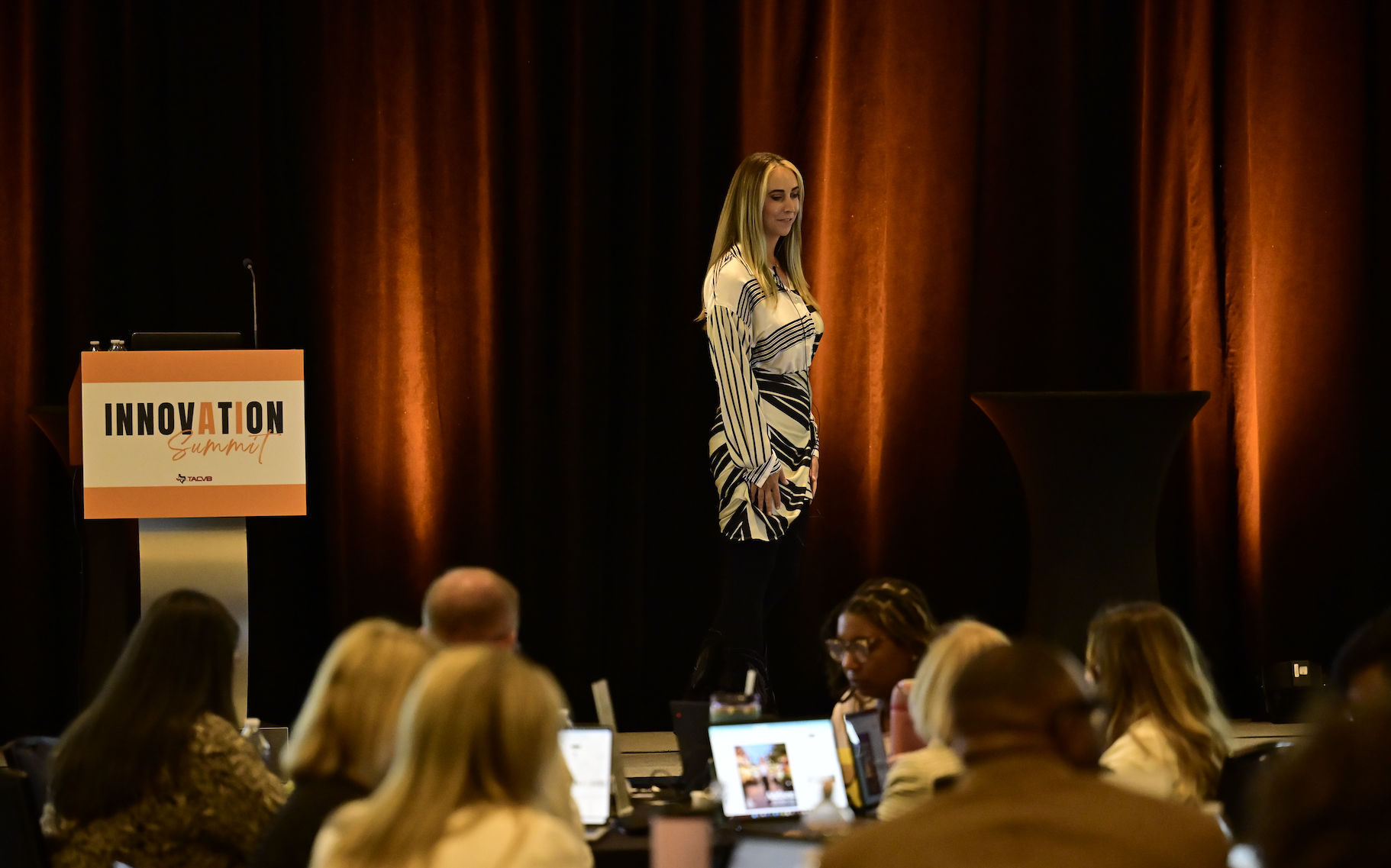 Jam Anderson delivering an AI keynote on stage at the Innovation Summit