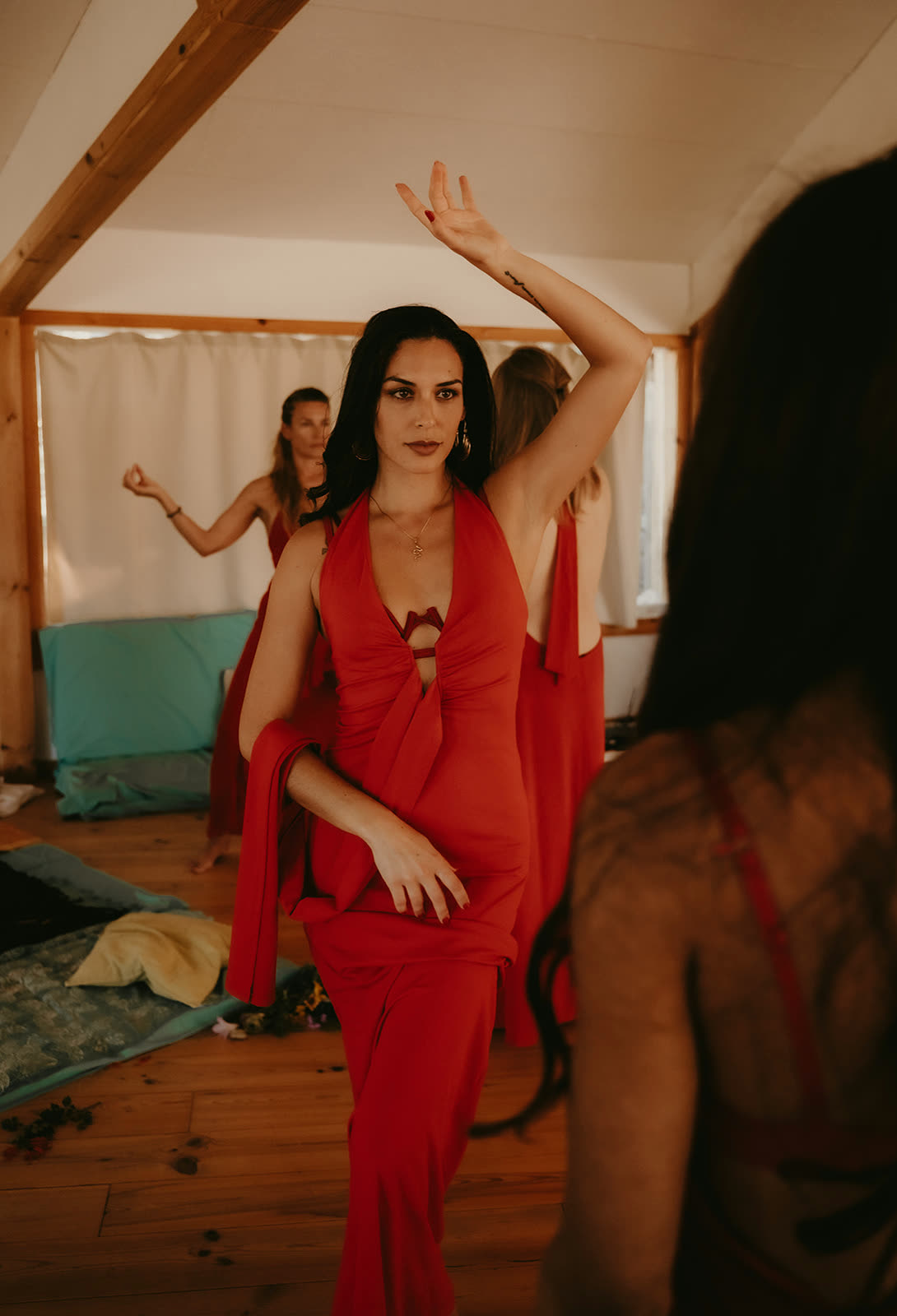 Woman in red dancing freely during Initiatress