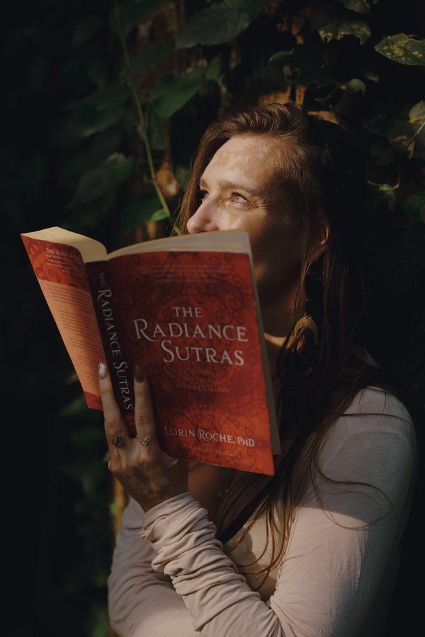 A woman reading The Radiance Sutras
