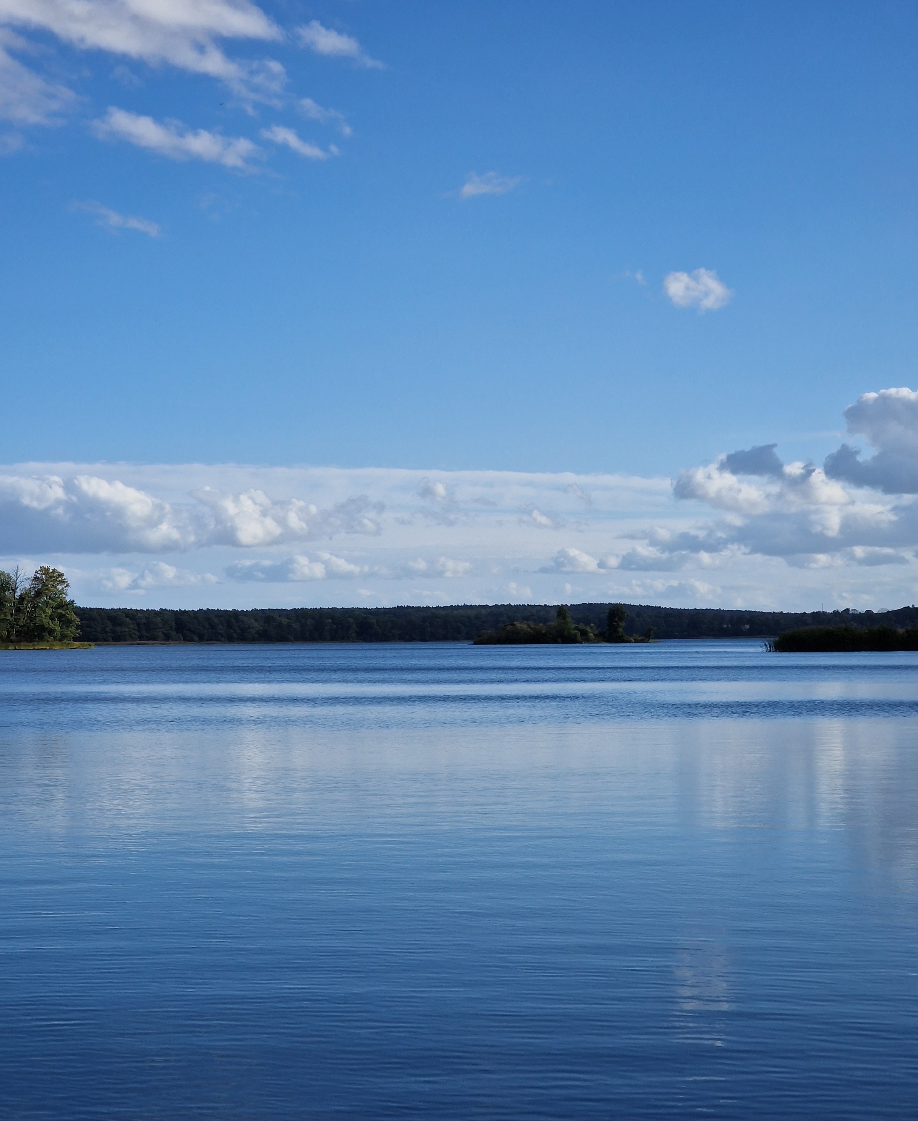 Calm lake under a wide sky