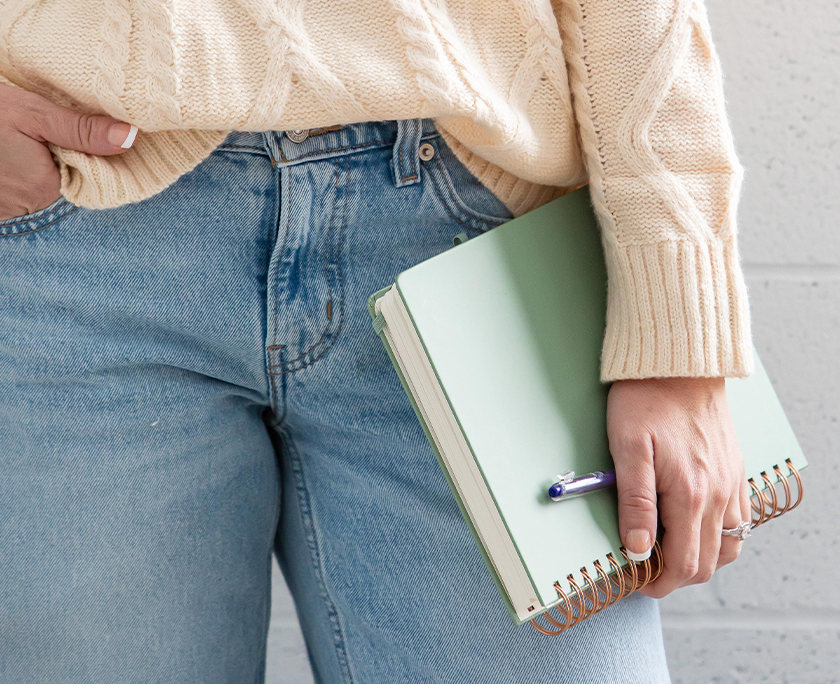 Woman holding a notebook