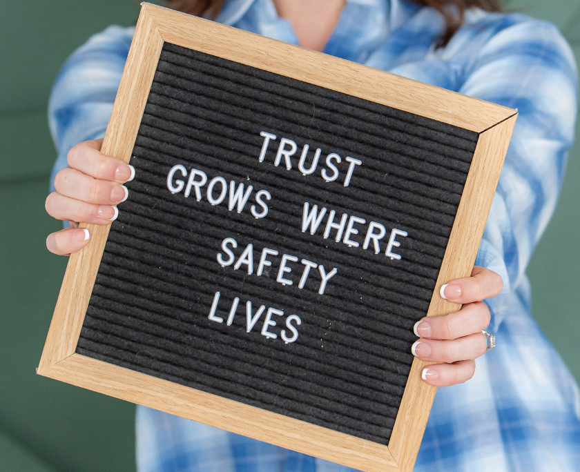 Sign saying Trust Grows Where Safety Lives
